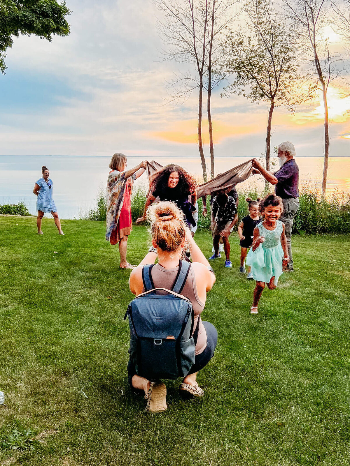 photographer taking photos of an extended family in door county
