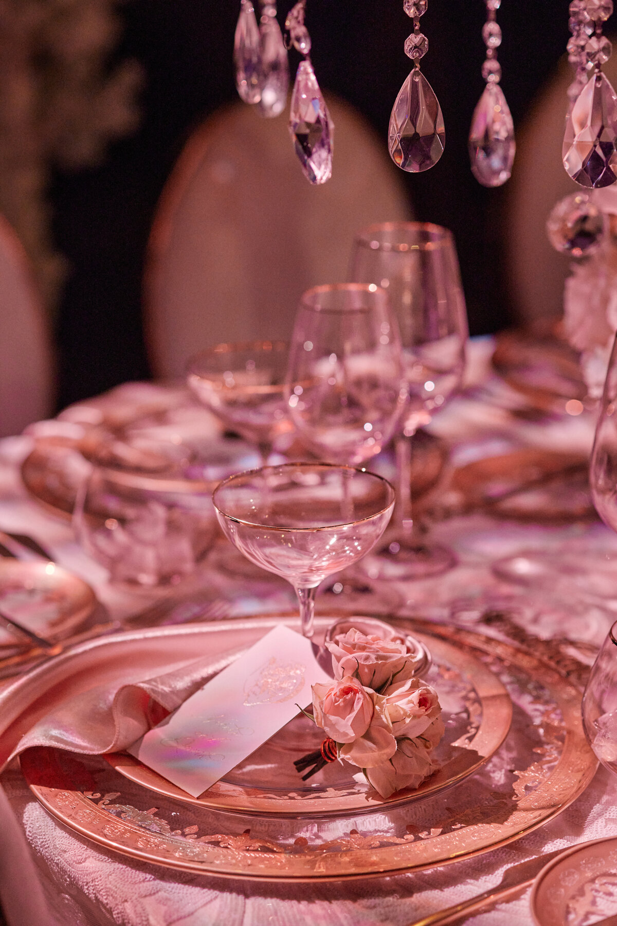 Place setting at wedding at Amangiri UTah in pink hues
