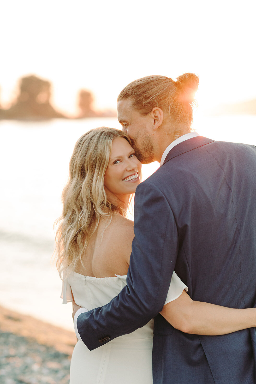 Utah Wedding Photography capturing groom kissing bride's forehead