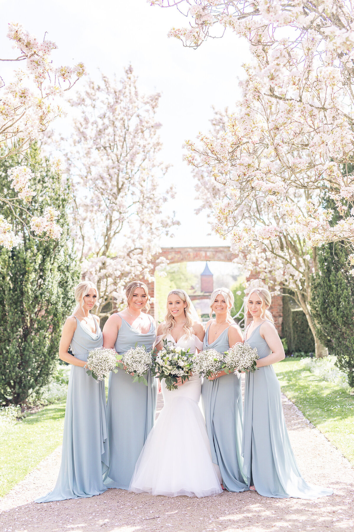 Bride standing with four bridesmaids at Combermere Abbey