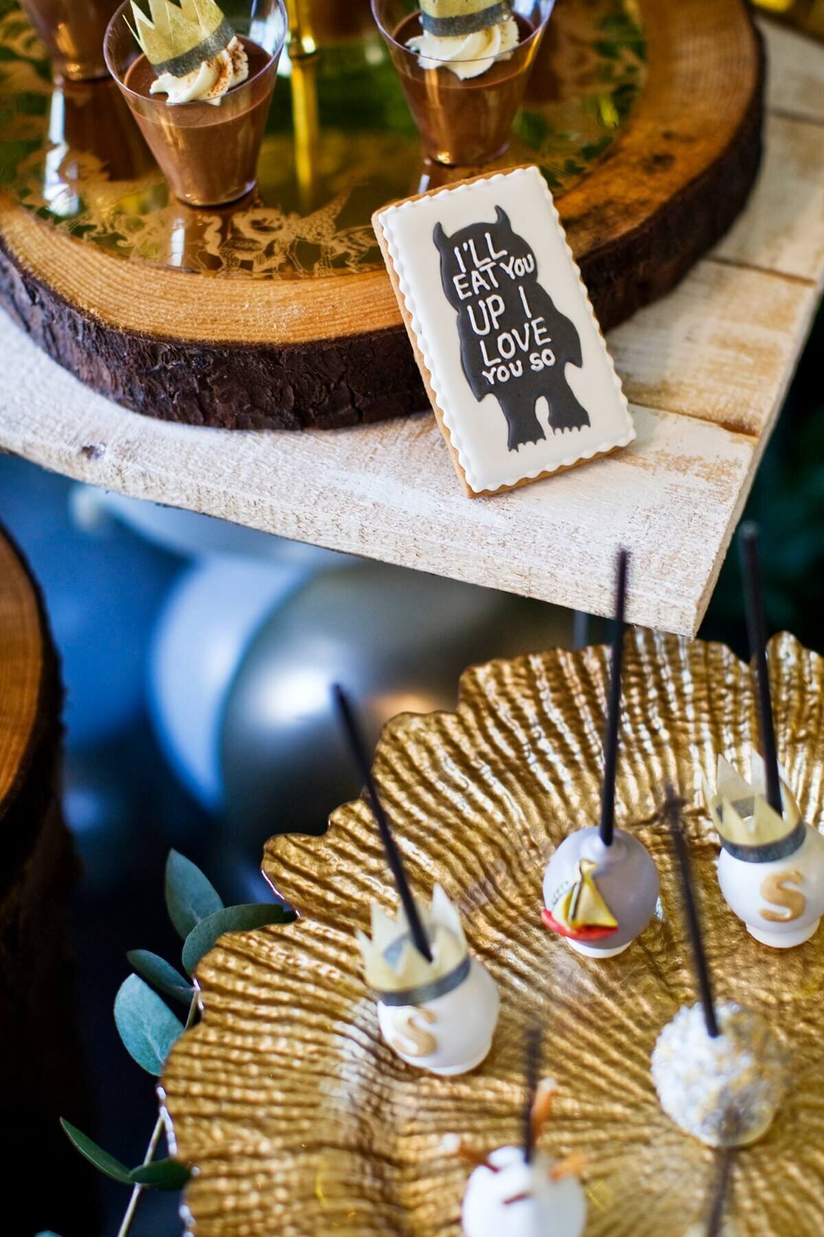 mini cake pops with gold sugar art on a gold charger plate