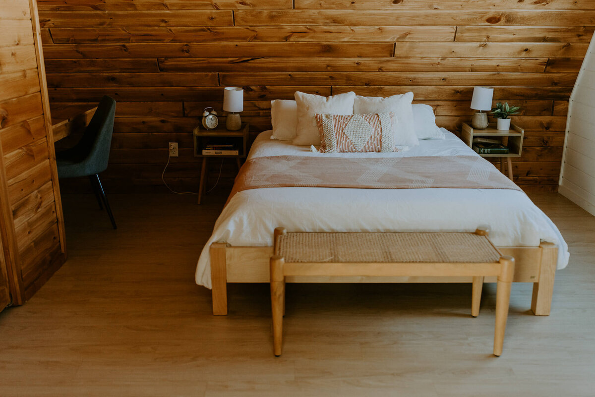 Cozy bedroom inside of aframe cabin airbnb.