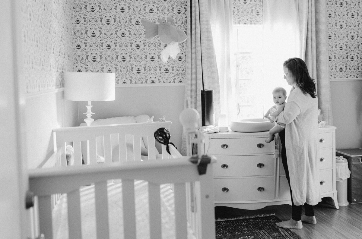 Mother with baby in nursery at Austin family photo session