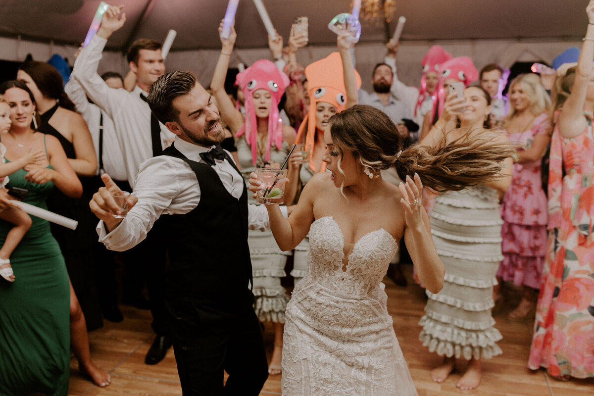 newlyweds walk on beach