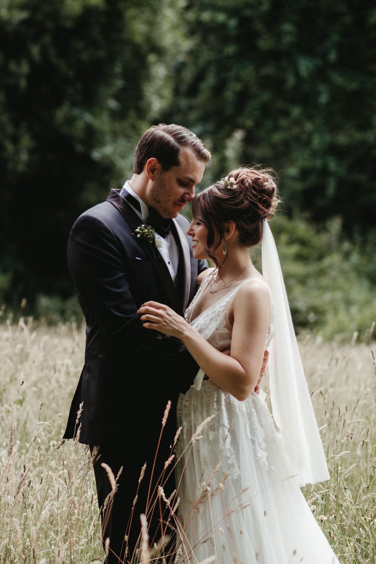 Bride wearing hair in an updo with short veil