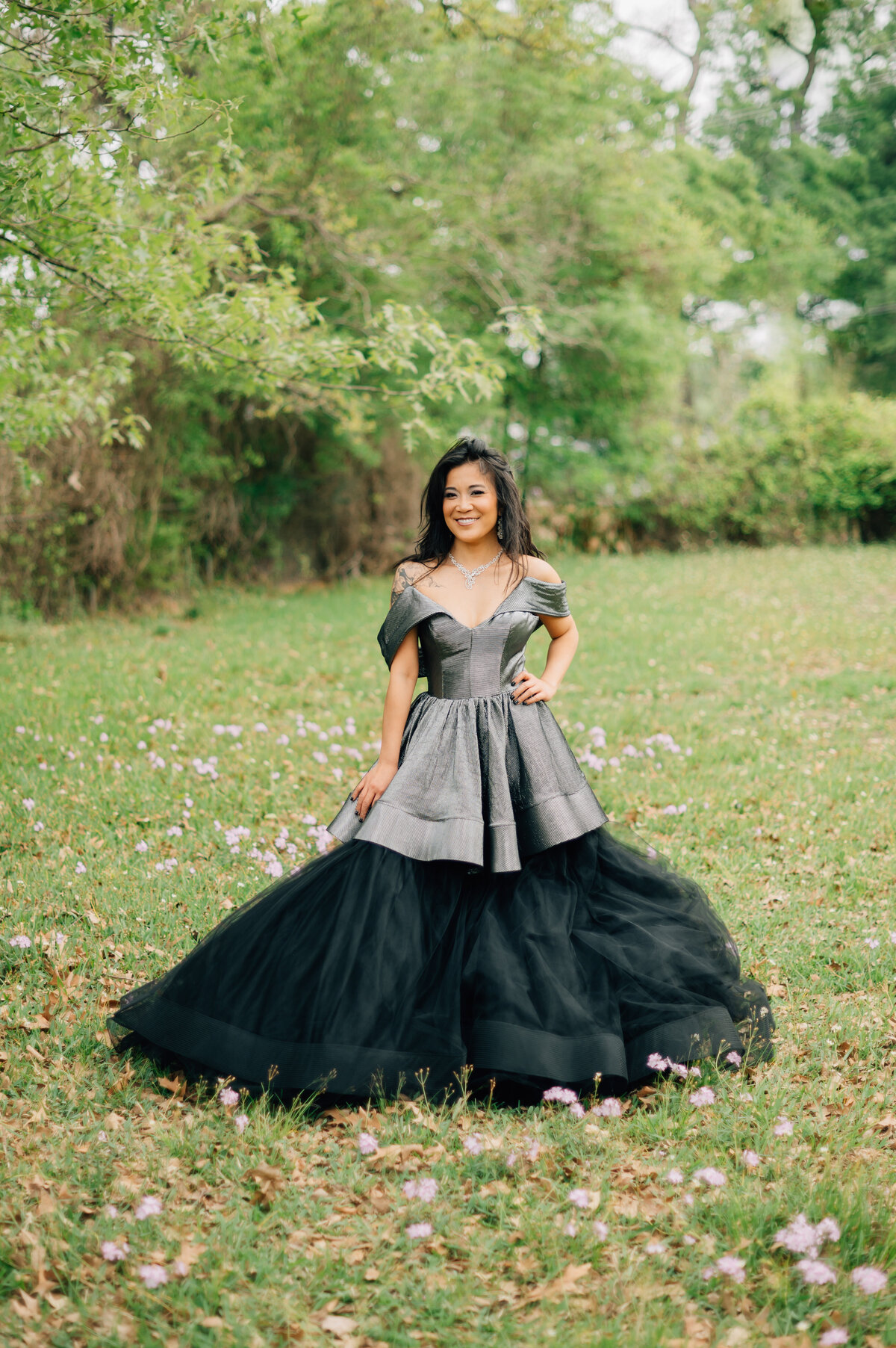 Fashion-forward woman in black couture gown photographed in a Houston park for Lissette G editorial shoot