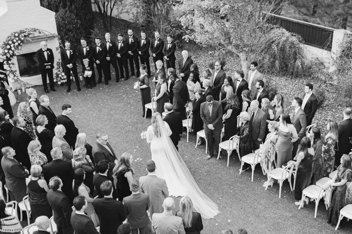 Overhead perspective of bride walking down aisle with father at The Bradford wedding venue