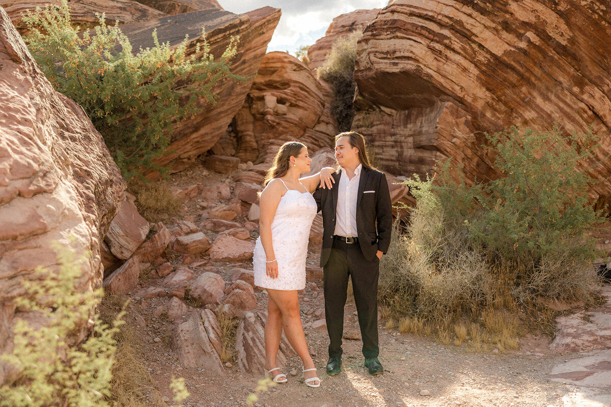 Engagement shoot at the Red Rock Canyon couple smiling at each other