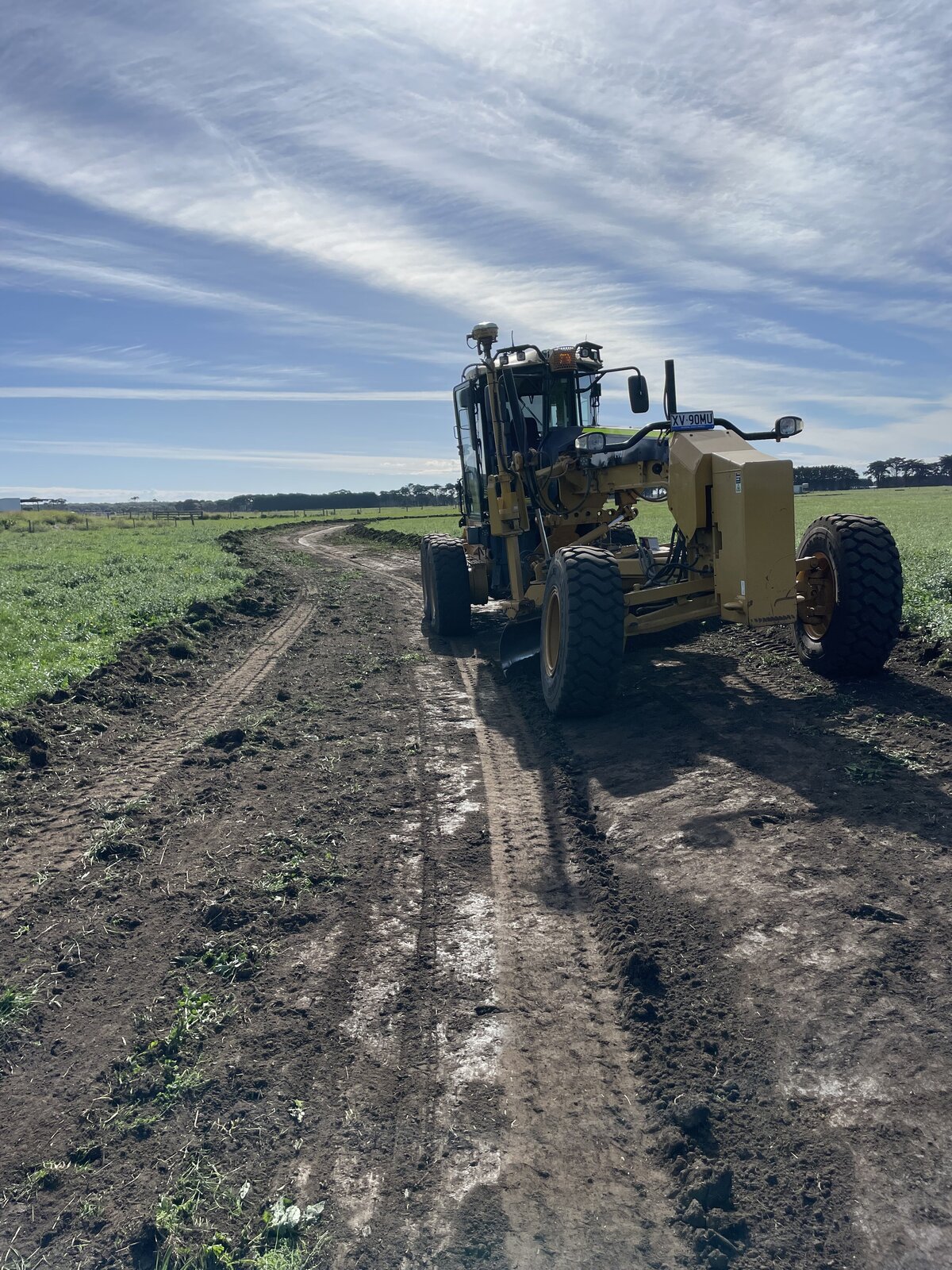 grader constructing farm drainage with GSP guidance