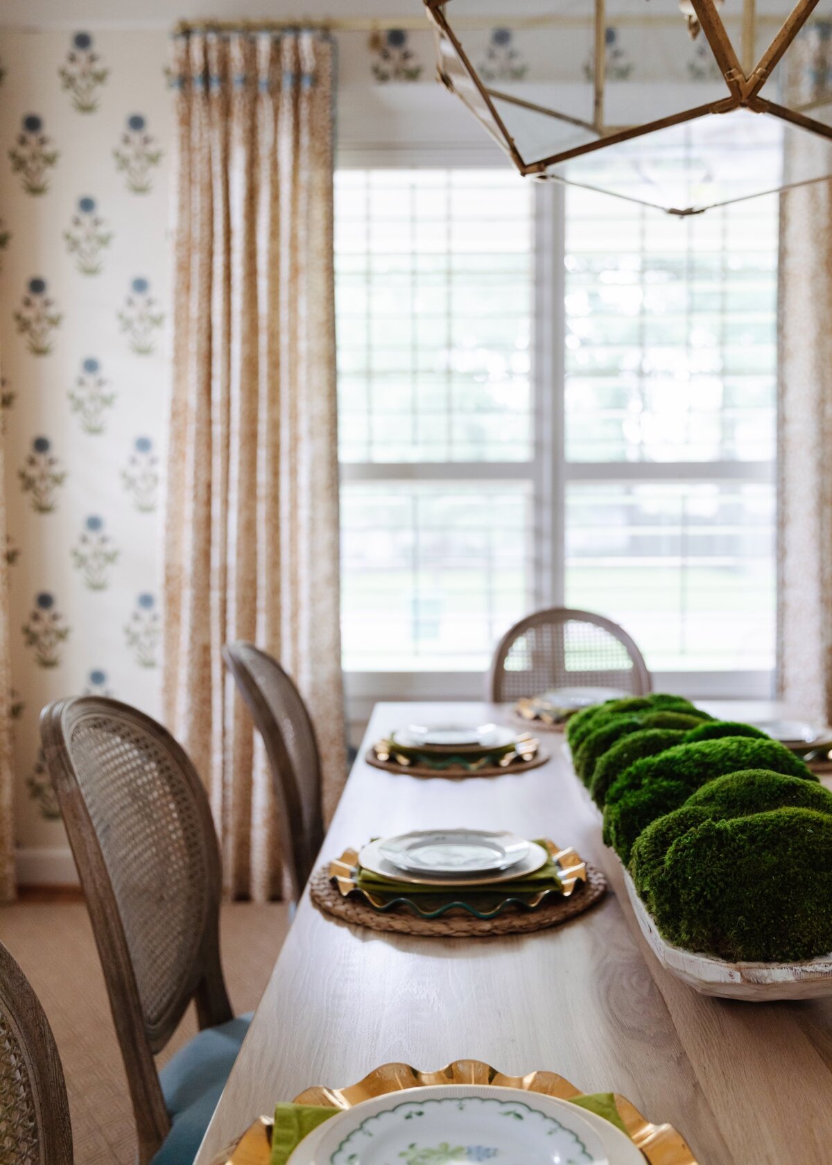 oyster creek studios oak forest remodel dining room table with plates and palnts in 