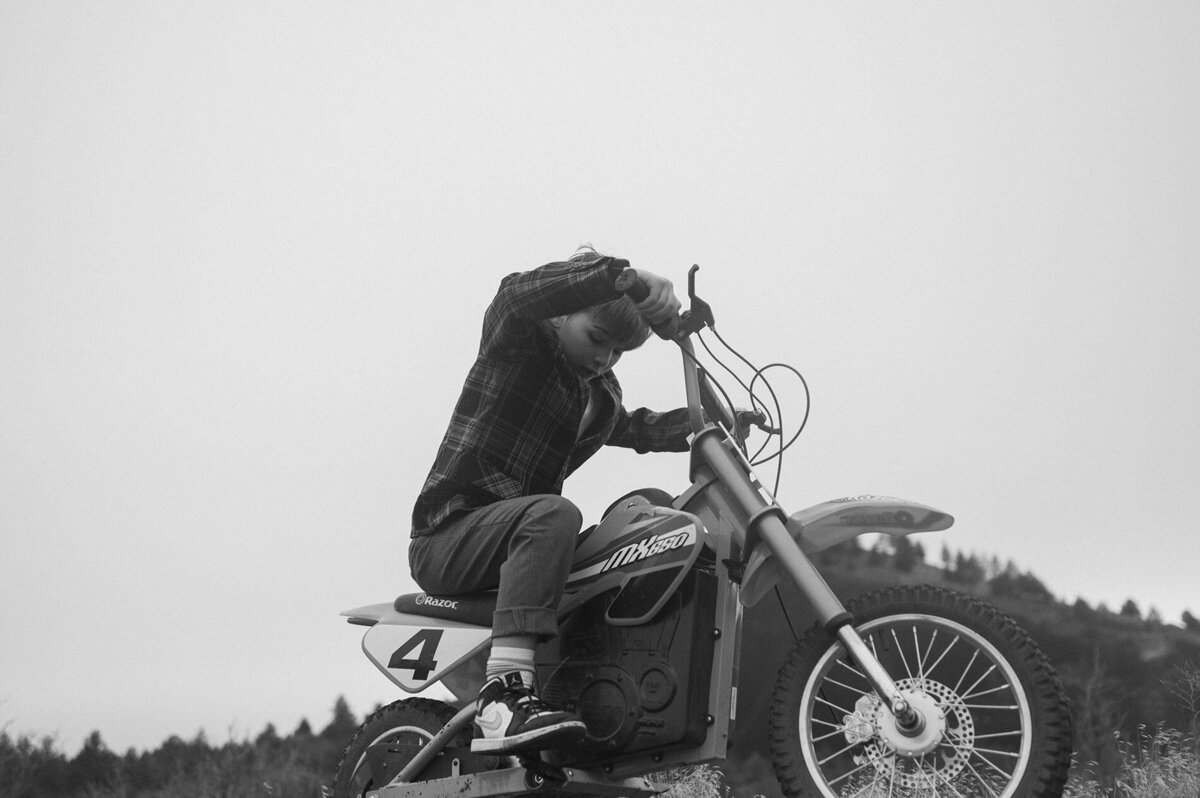 Little boy having fun on vintage motorcycle in Bend, Oregon