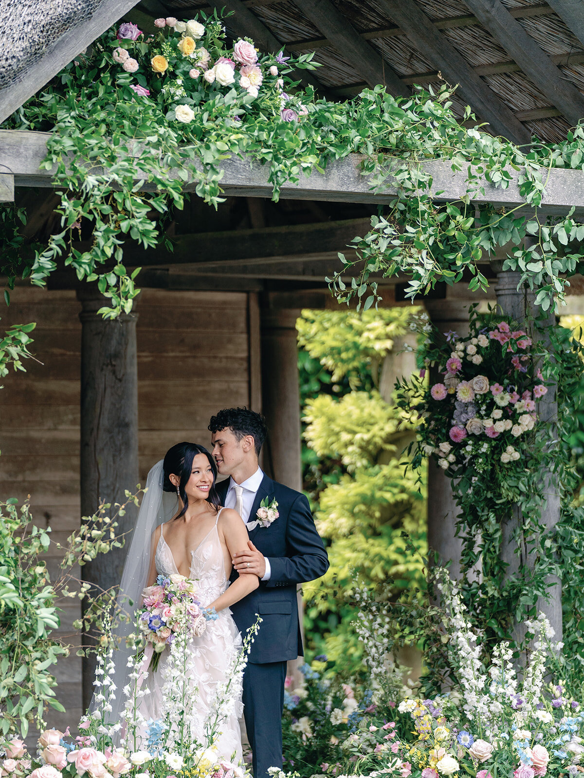 Wedding ceremony outdoors in the garden at Euridge Manor