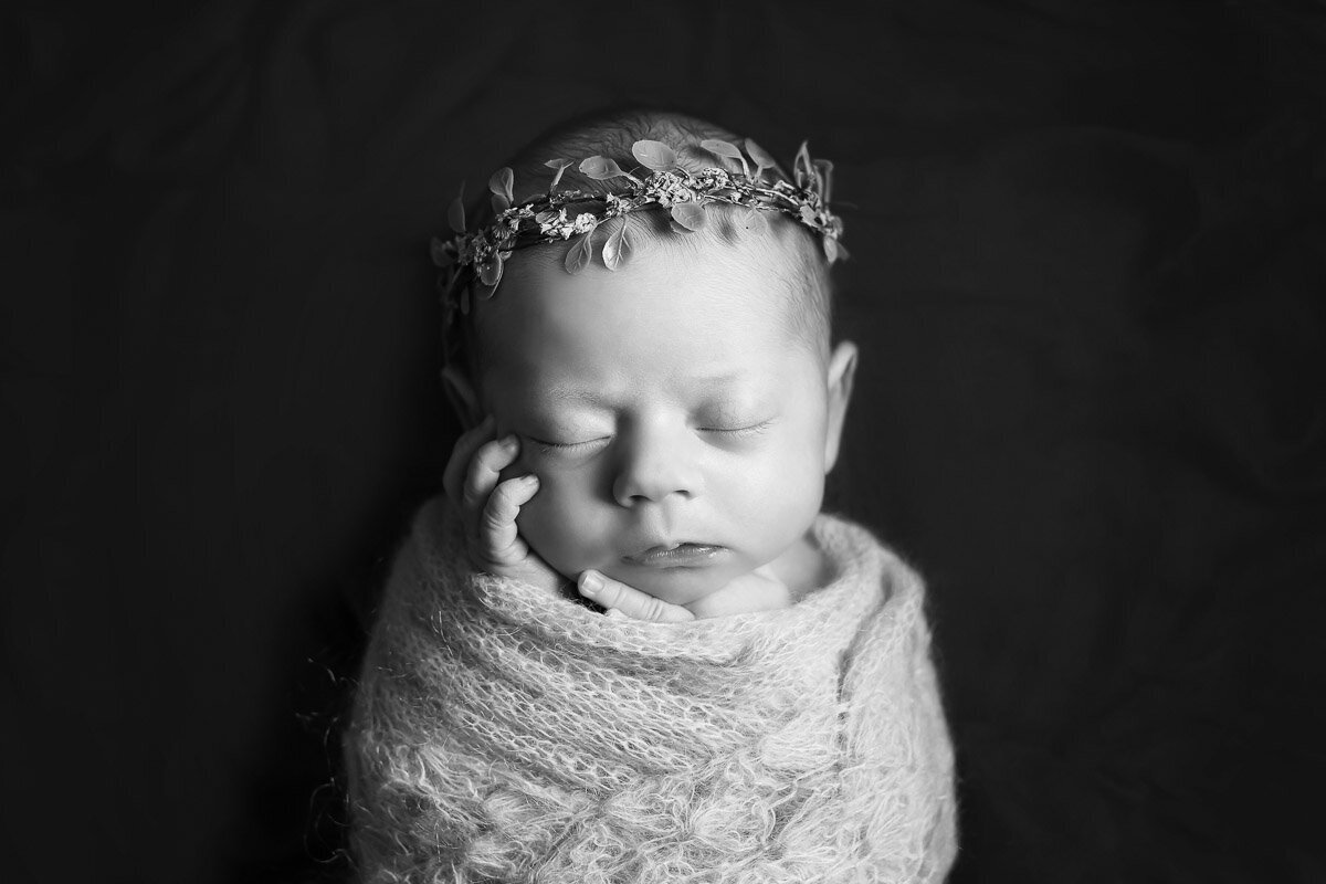 Black and white portrait of newborn baby sleeping taken by Yuliia Terziian Photography in Calgary,Alberta