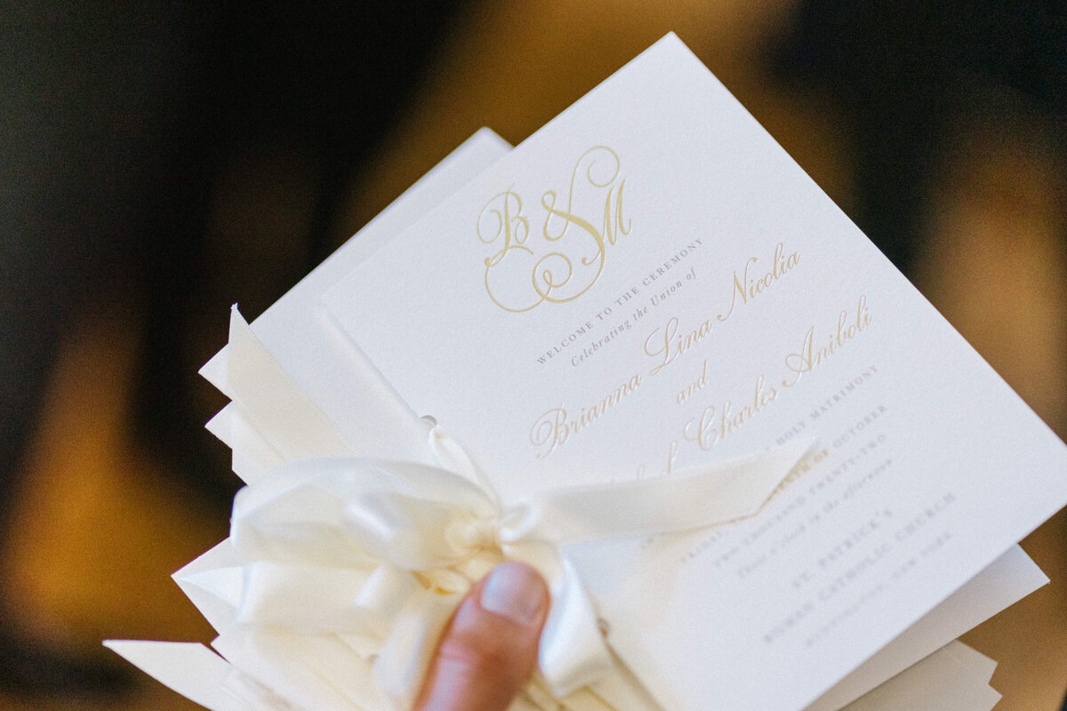Formal cream and gold luxury wedding program