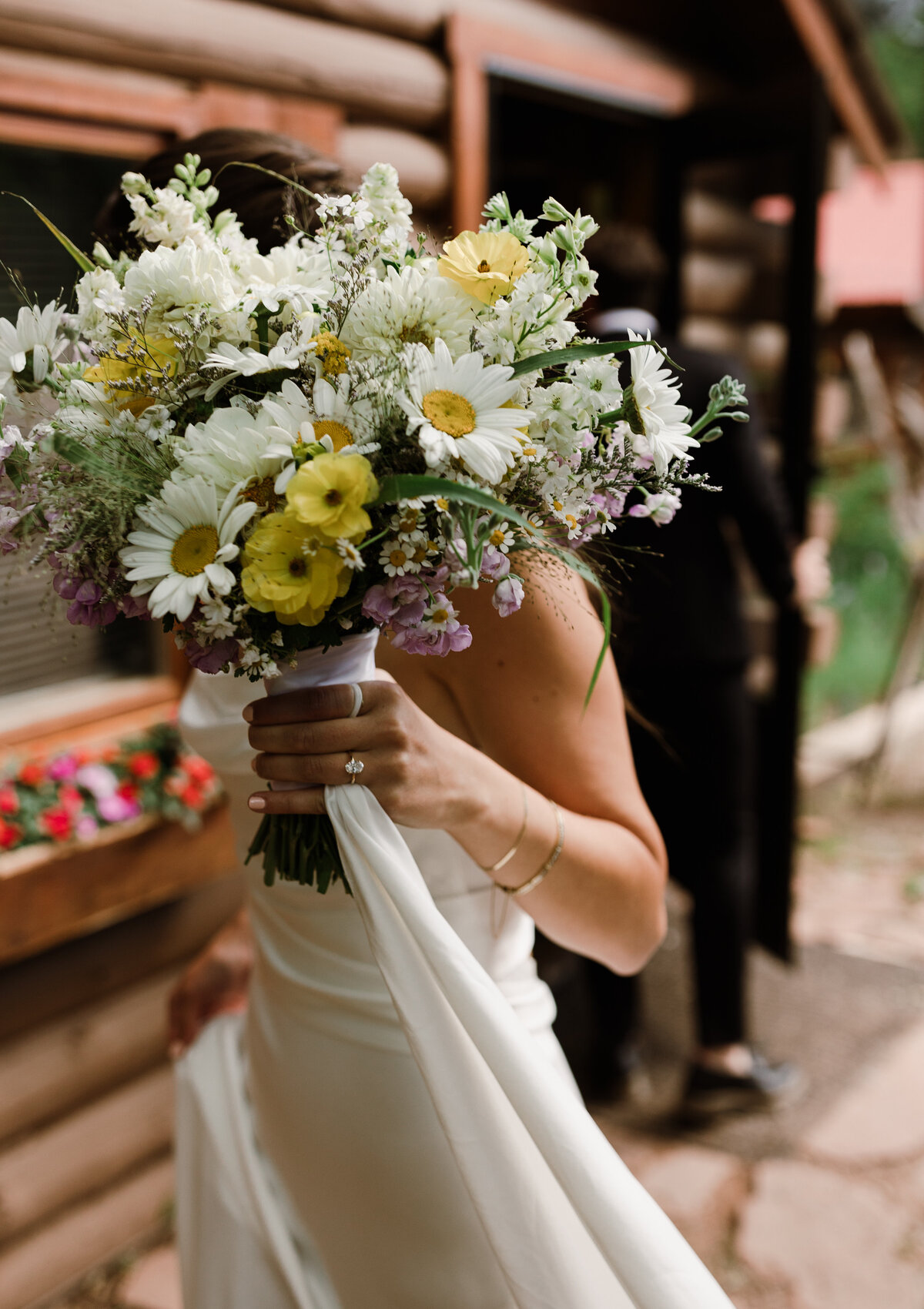 Brides wildflower bouquet of white and yellow florals