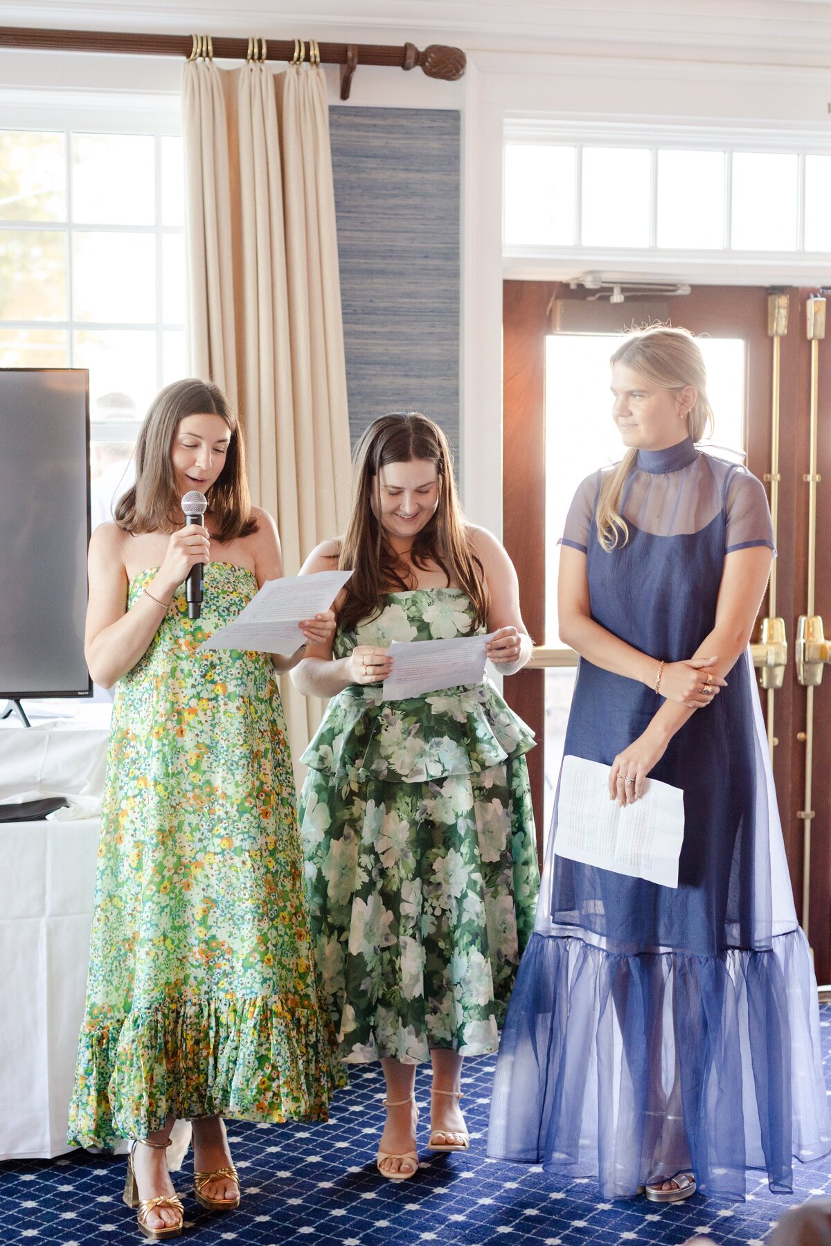 bridesmaids giving speeches at rehearsal dinner