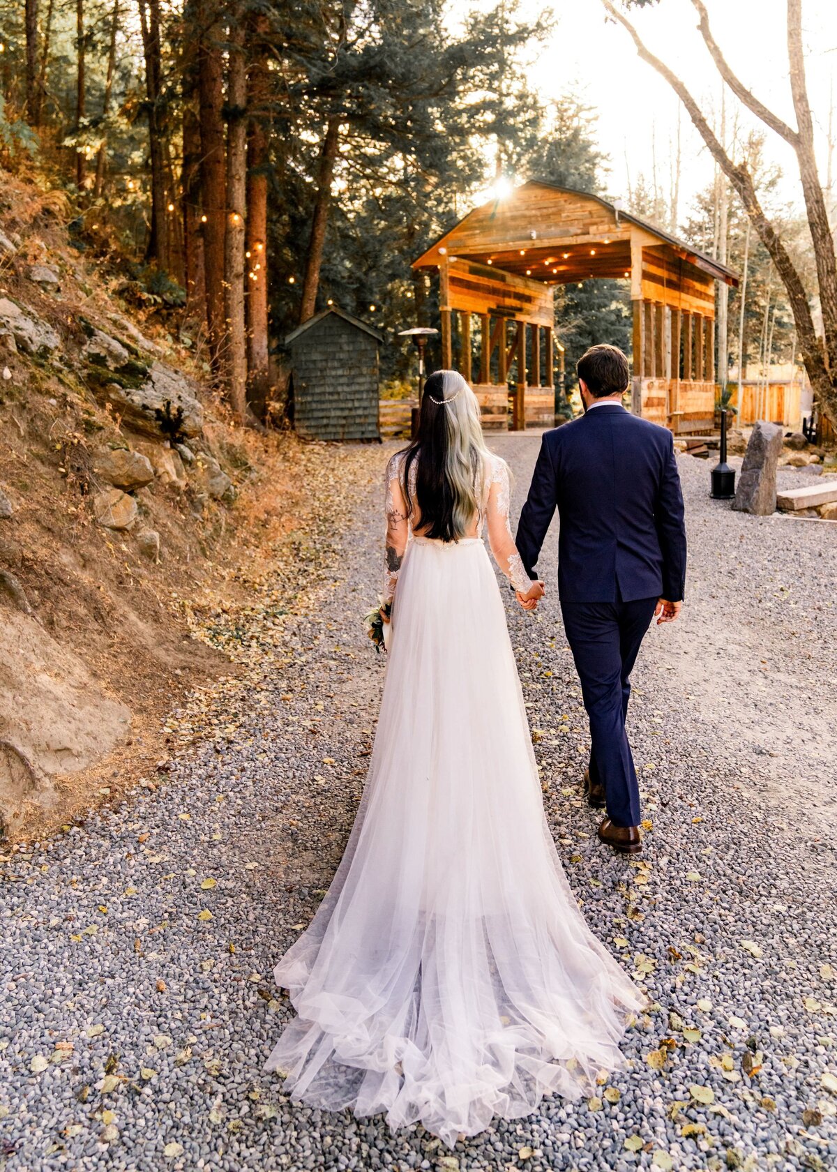 denver colorado wedding photographer - couple holding hands and walking