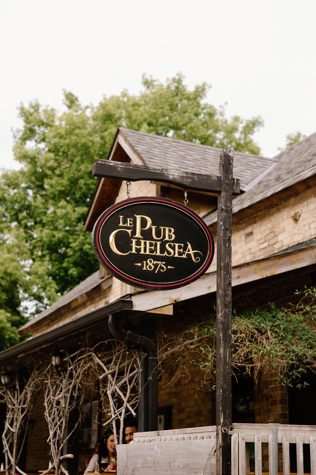 A close-up shot of the signage of Le Pub Chelsea for a wedding photography