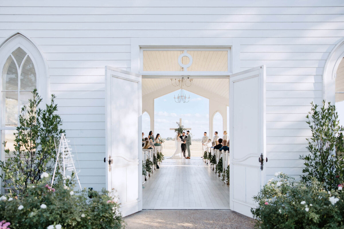 wedding ceremony at wedding chapel at Chandelier Farms in Terrell, Texas