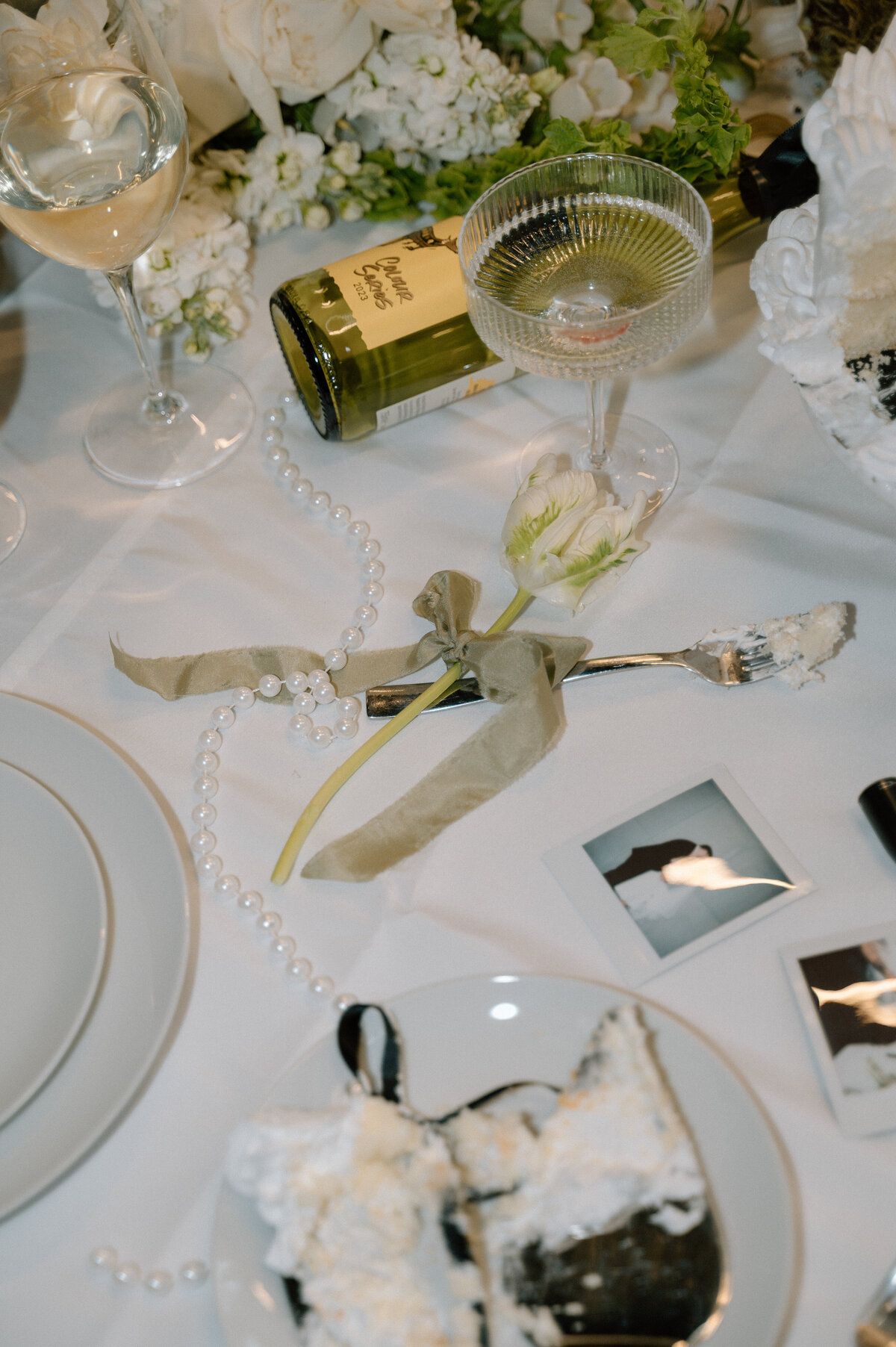 Champagne, cake, and floral decor captured in luxury Banff wedding reception.