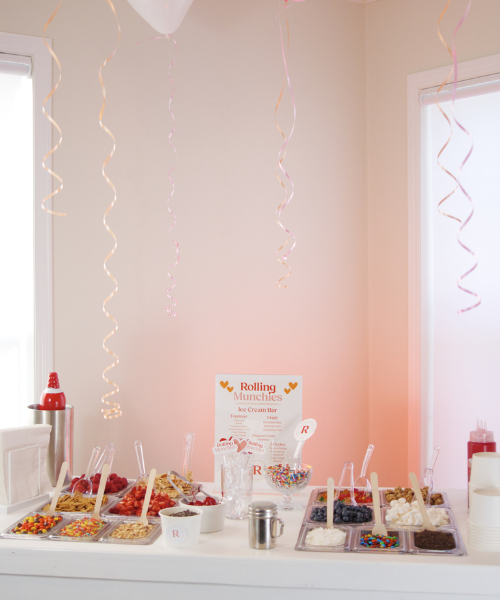 Ice cream station with syrups and colorful toppings