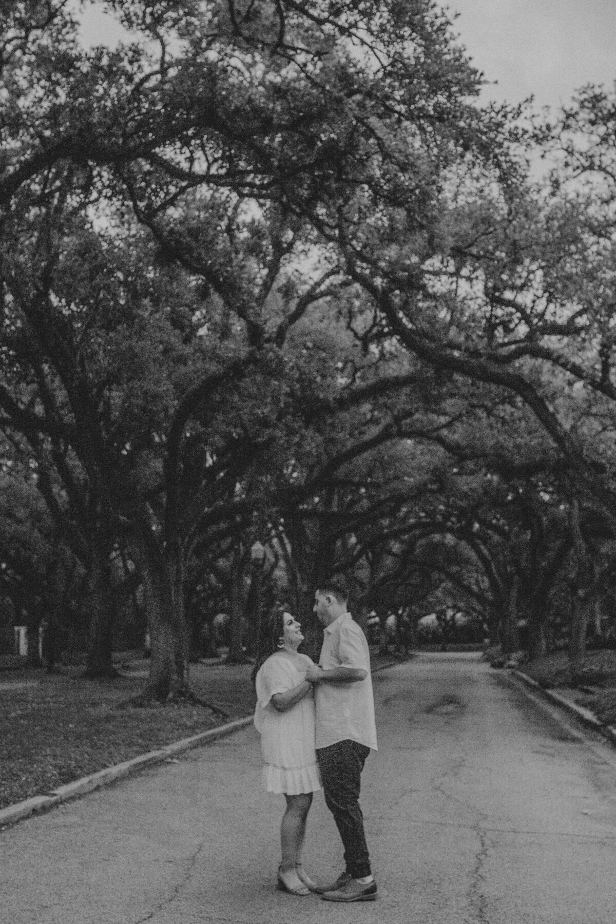 Exploring the lively atmosphere of Rice Village in Houston, Tx, I had the privilege of photographing this couple's engagement session as they shared sweet moments amidst the neighborhood's charm. Against the backdrop of quaint boutiques and bustling cafes, the couple's love radiated, creating a romantic and timeless story of their journey together.