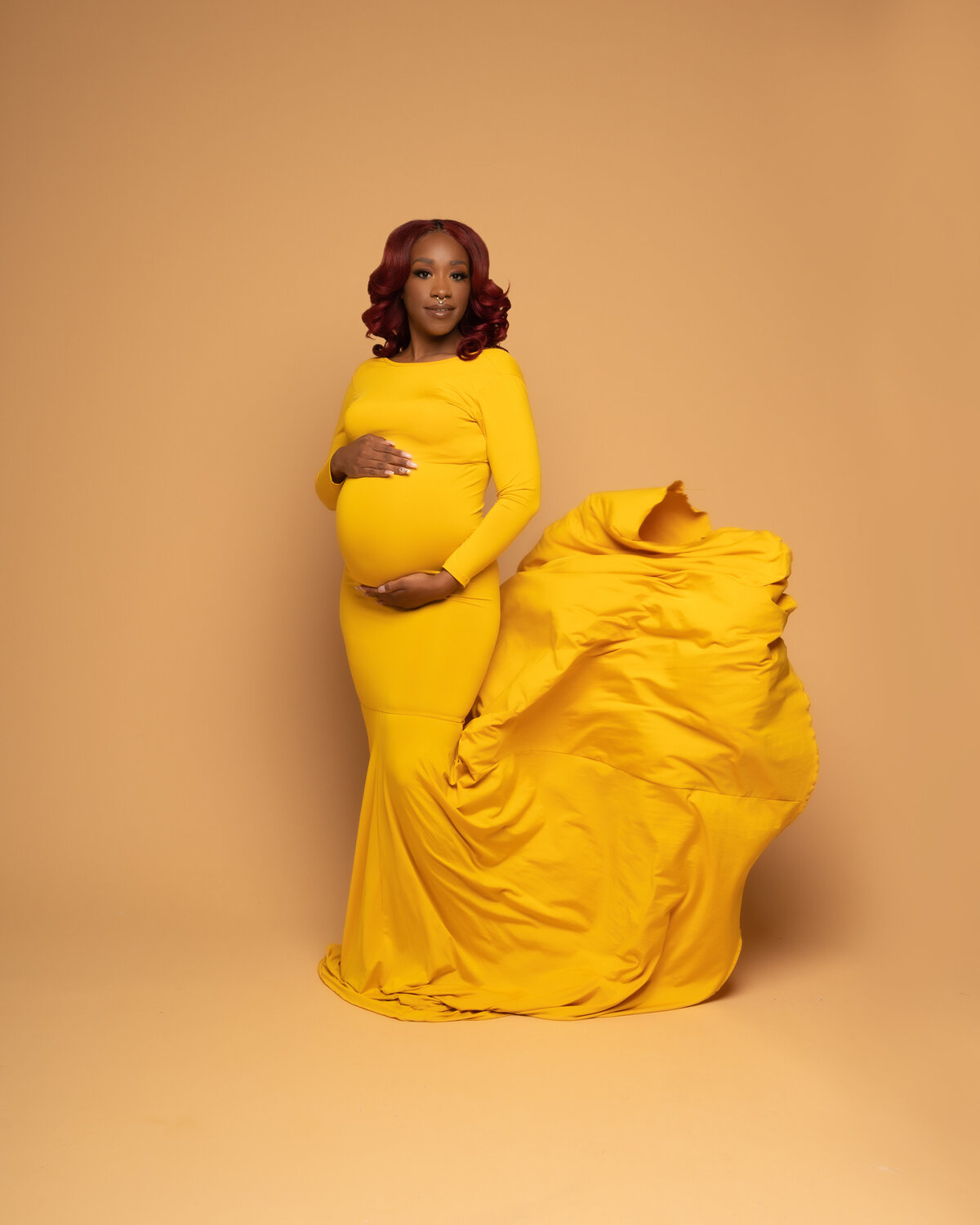 Black pregnant mom to be in yellow dress