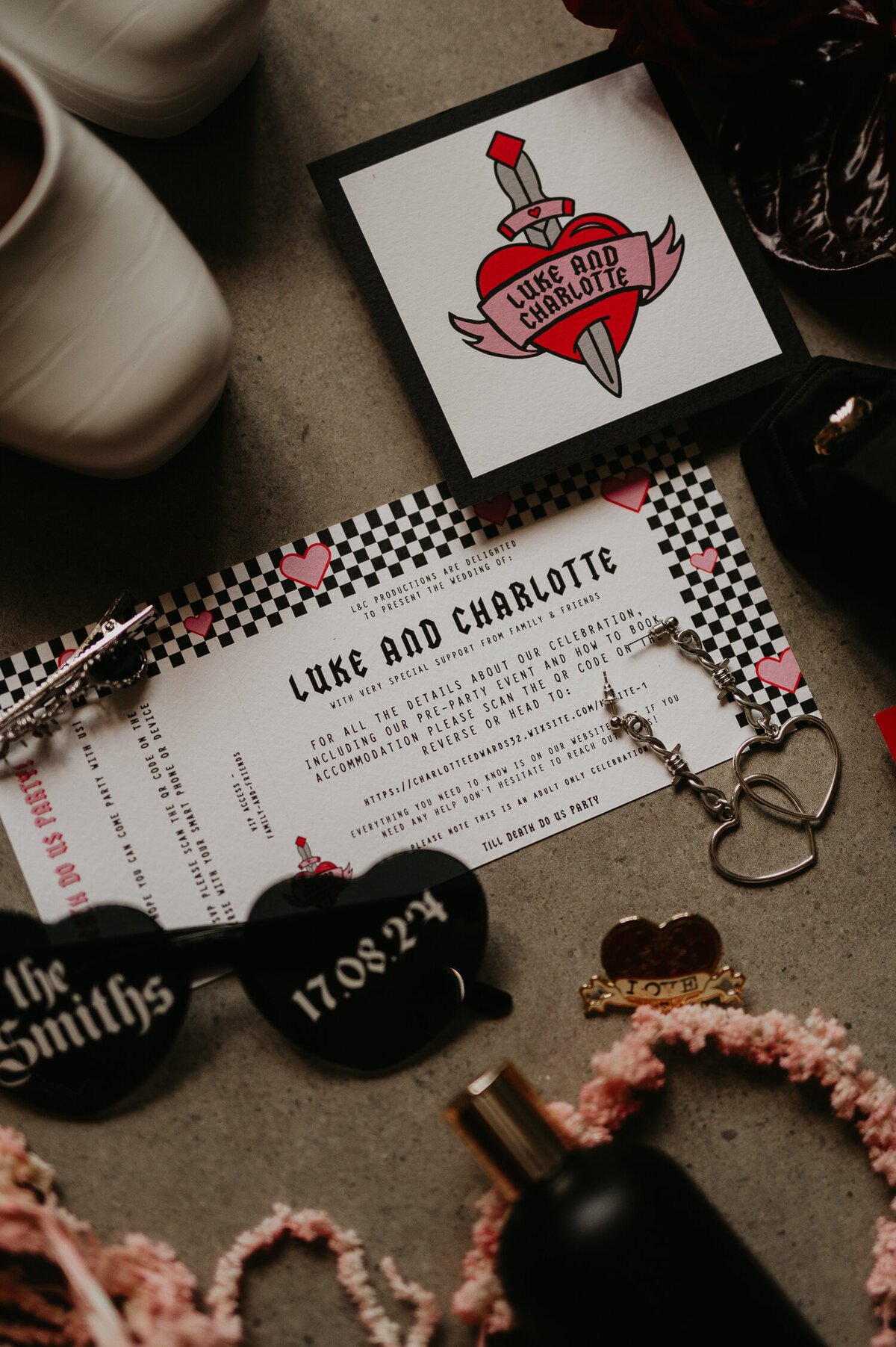 Wedding stationery resembling concert tickets with hearts on.