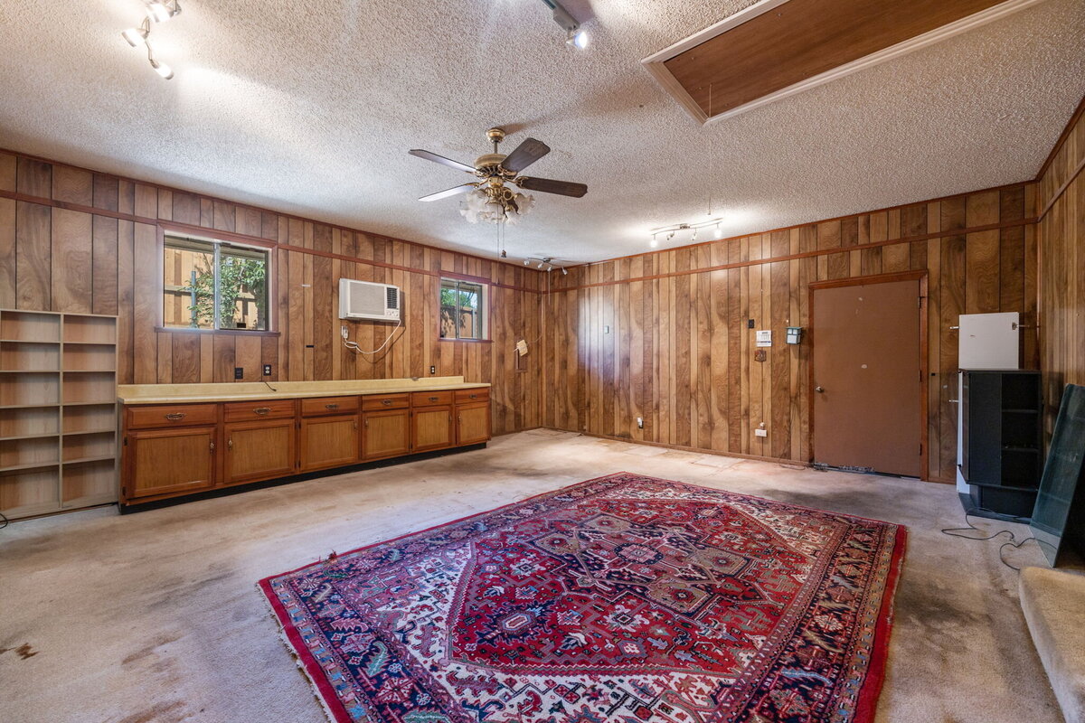 14214_edgecrest_dr_dallas_tx_bonus_room_-flex_space_with_wood_paneling_and_vintage_ceiling_fan-_haven_realty_group