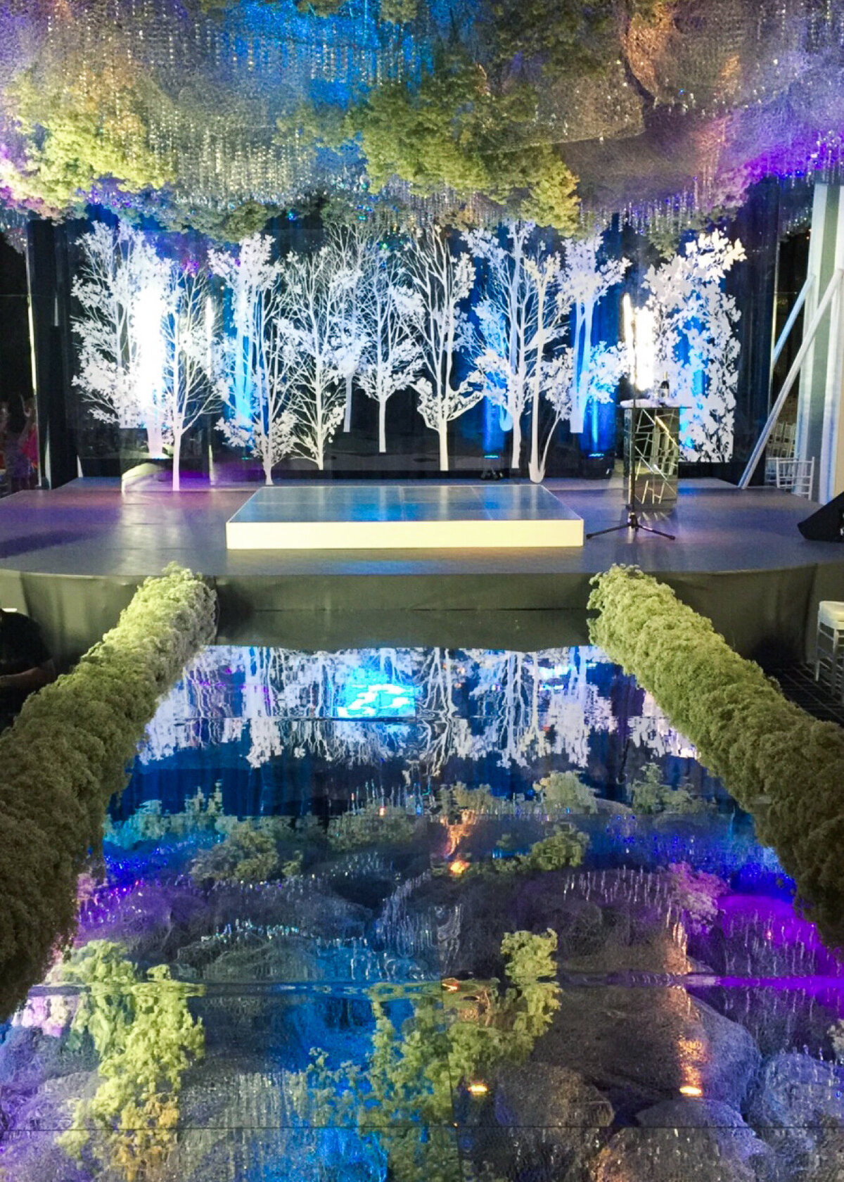 A mirrored wedding aisle or brand event stage planned by a celebrity event planner