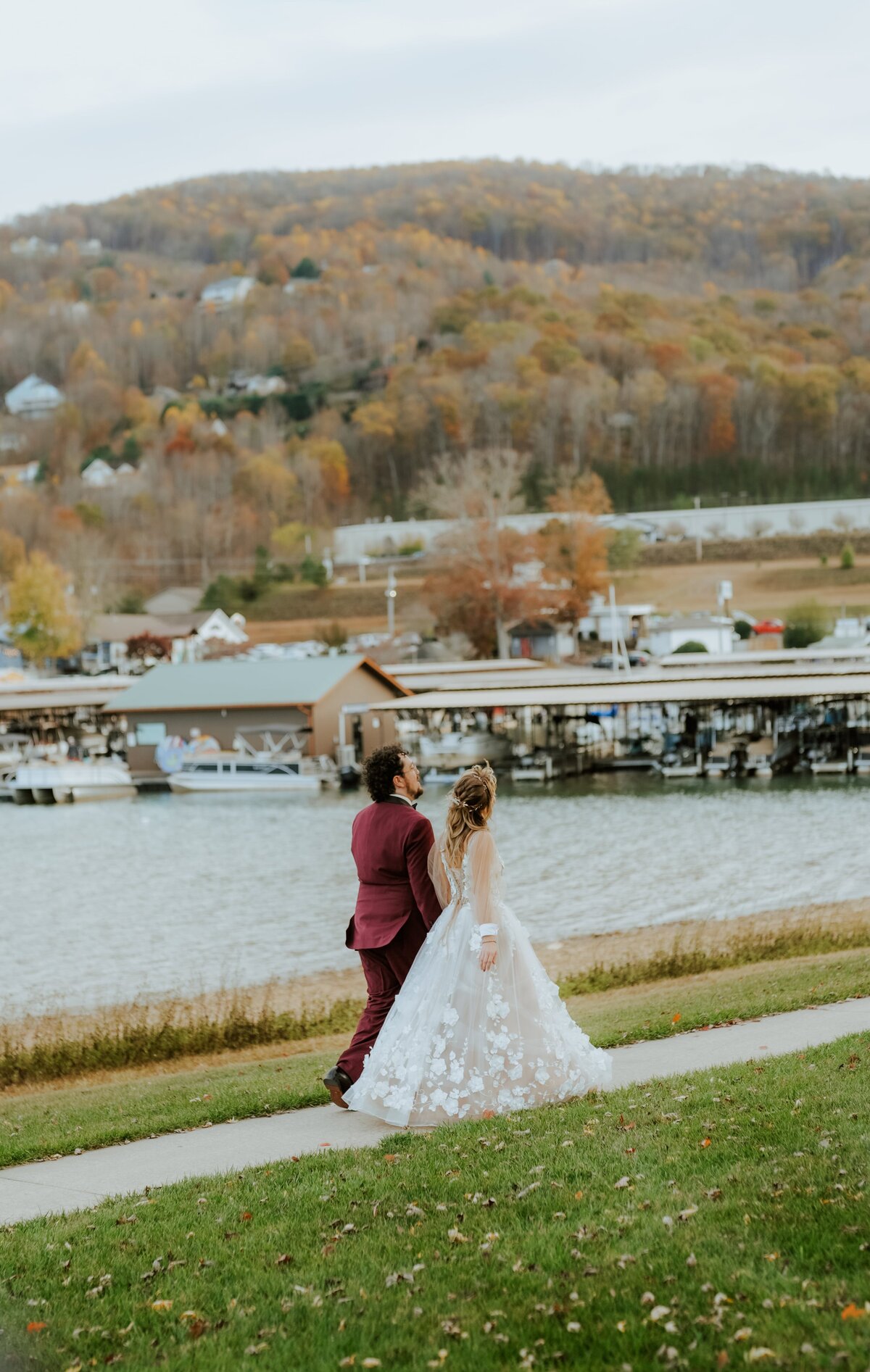 Couple walking by a lake.