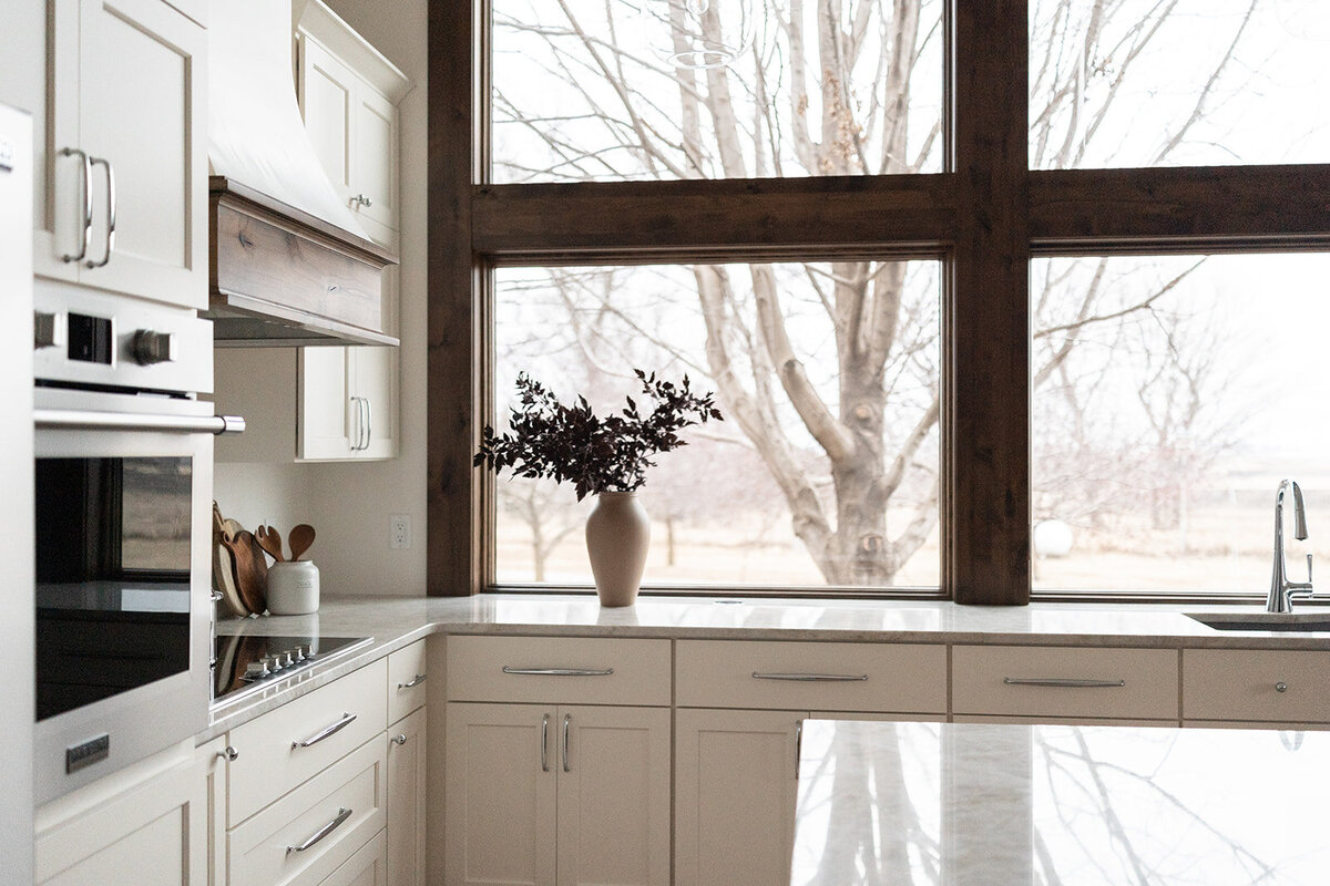michele rosenboom design clean country renovation kitchen island with large wood trimmed windows