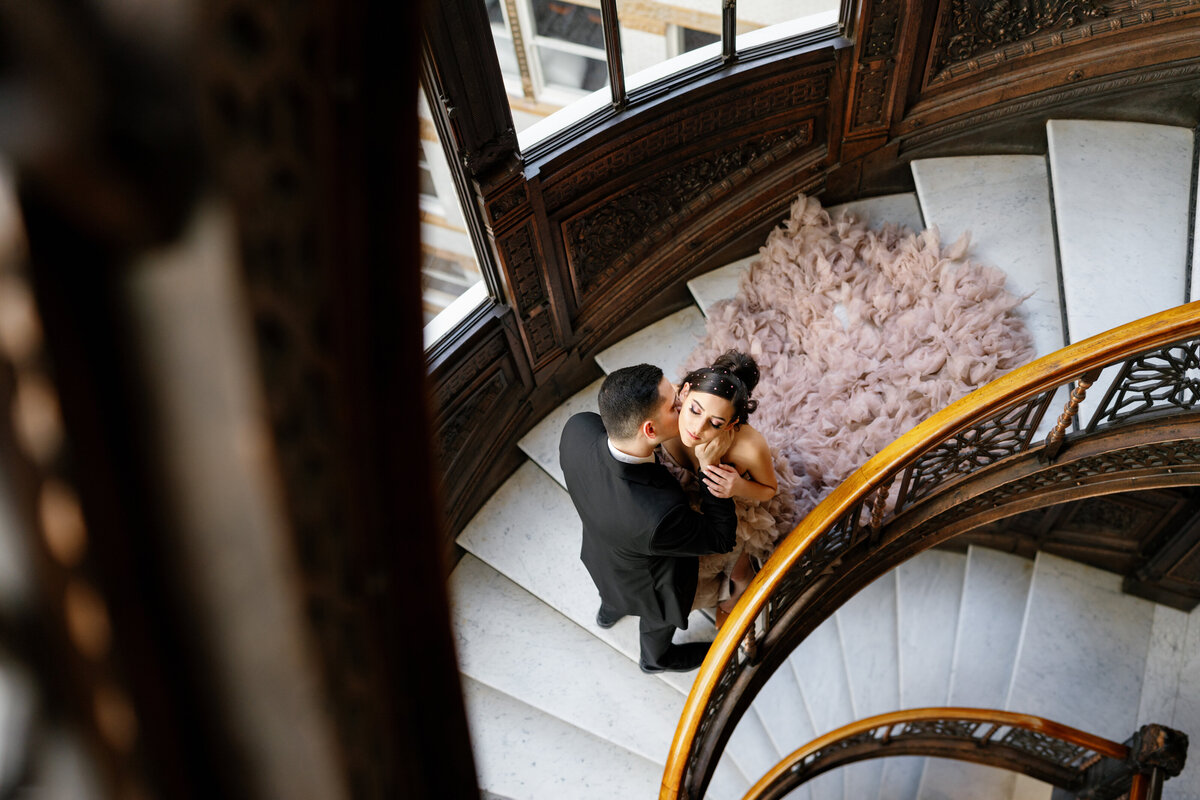 Aspen-Avenue-Chicago-Wedding-Photographer-Rookery-Engagement-Session-Histoircal-Stairs-Moody-Dramatic-Magazine-Unique-Gown-Stemming-From-Love-Emily-Rae-Bridal-Hair-FAV-17
