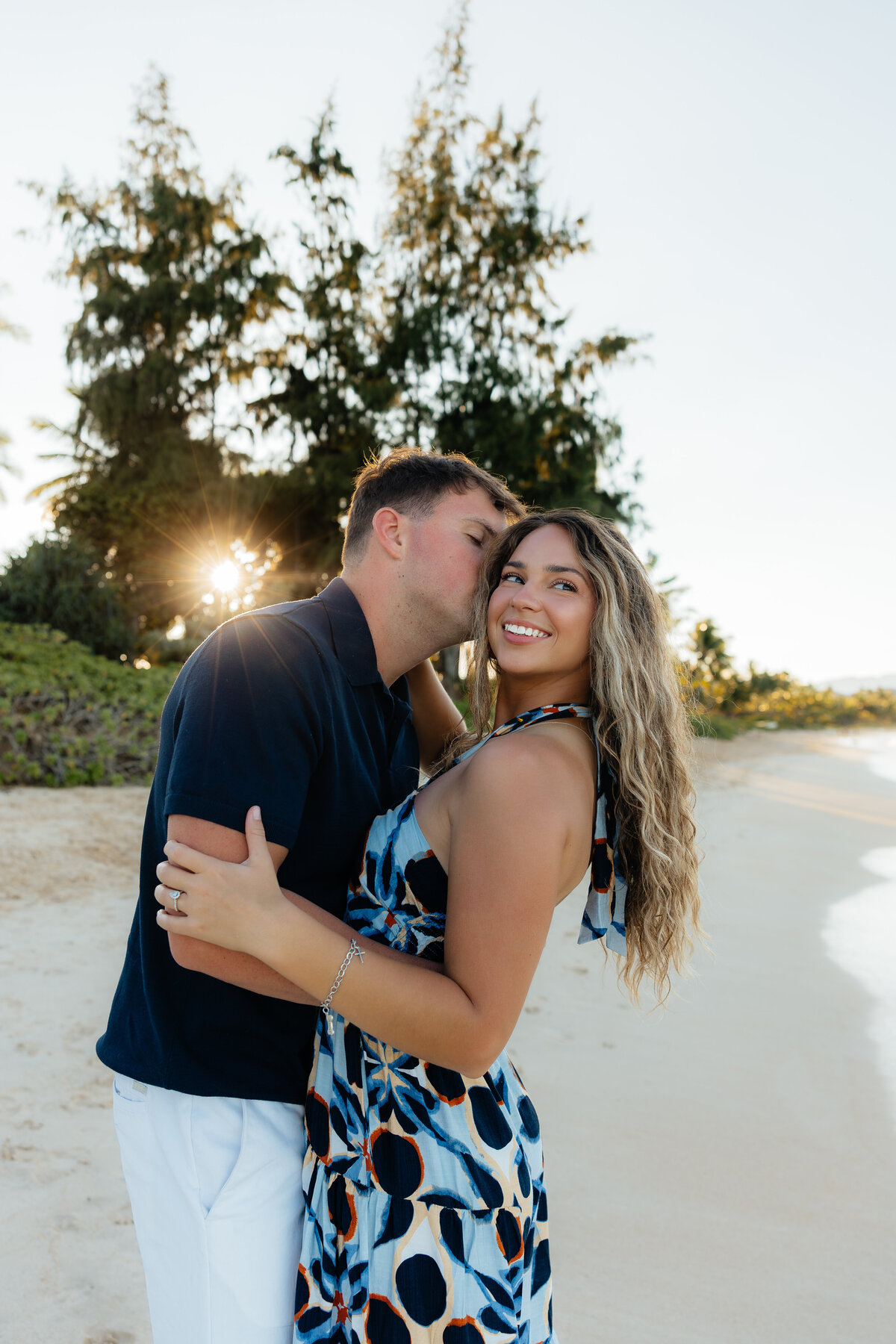 Oahu photographer capturing love between a couple on the beach.