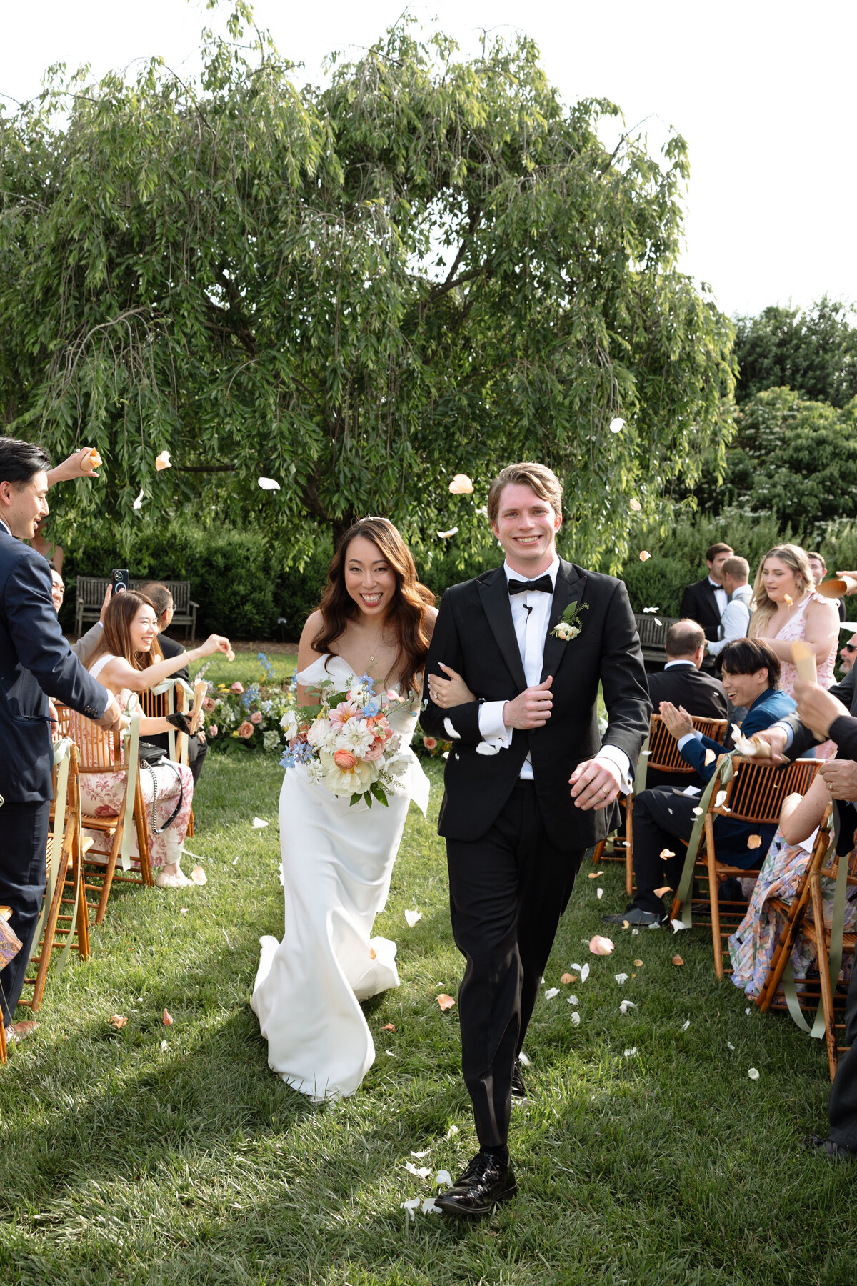 Couples processing down aisle at the market at grelen.