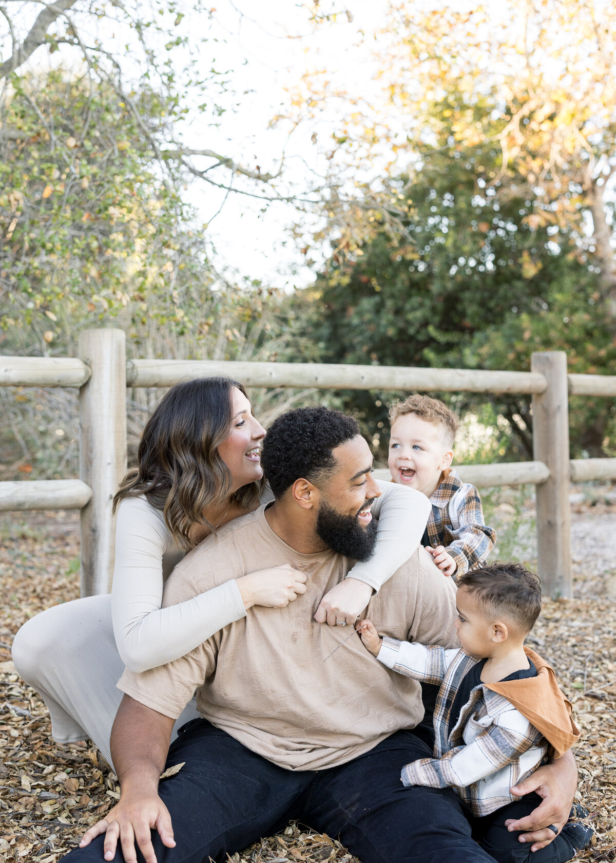 laughing family photo with two kids