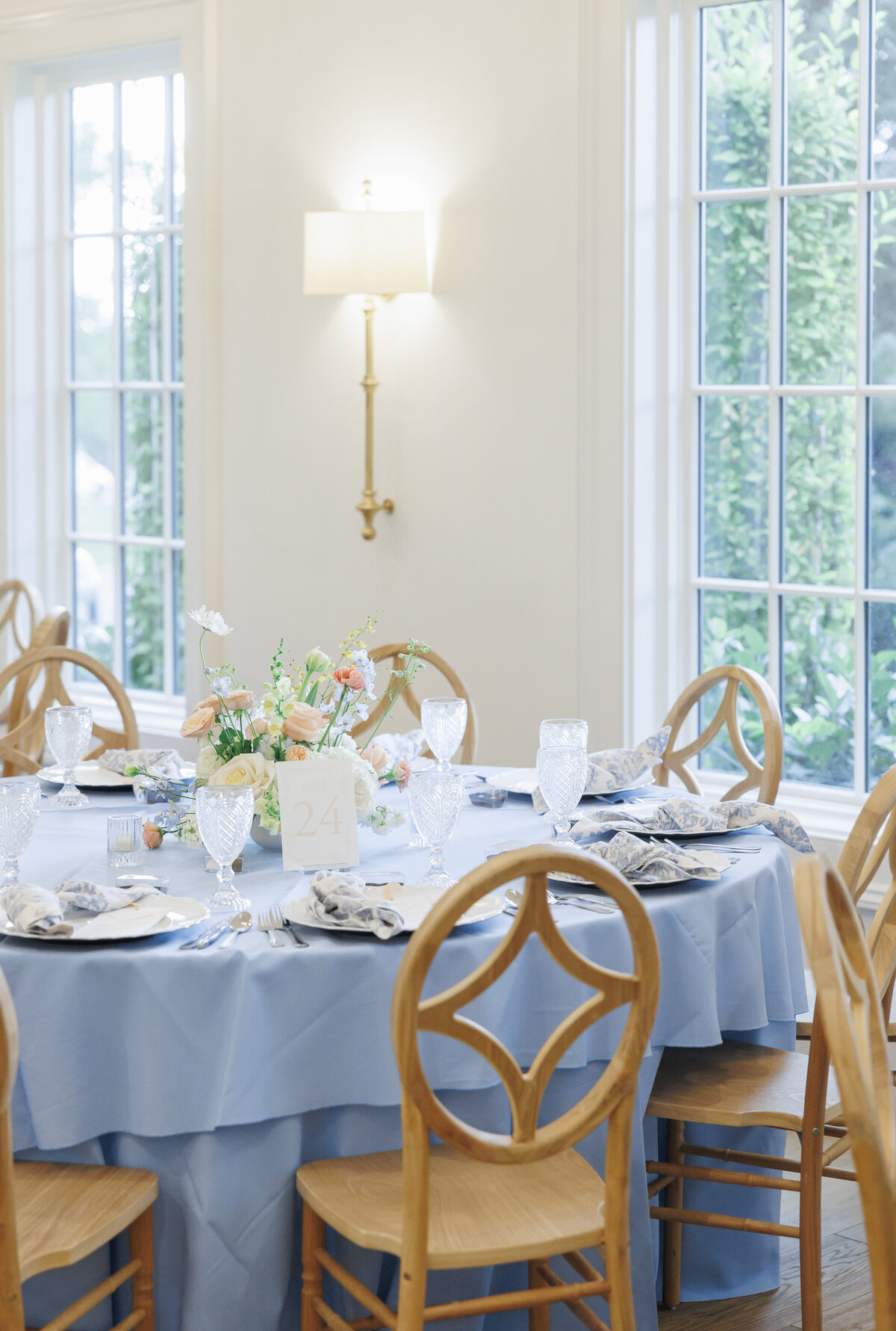 Custom blue floral napkins with scalloped plates for a wedding reception at Twenty and Creek 