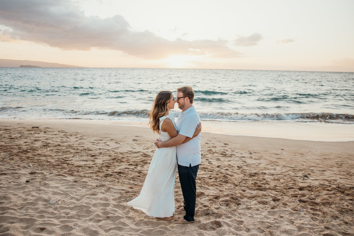 Hawaii Engagement Photographer captures man and woman embracing on beach