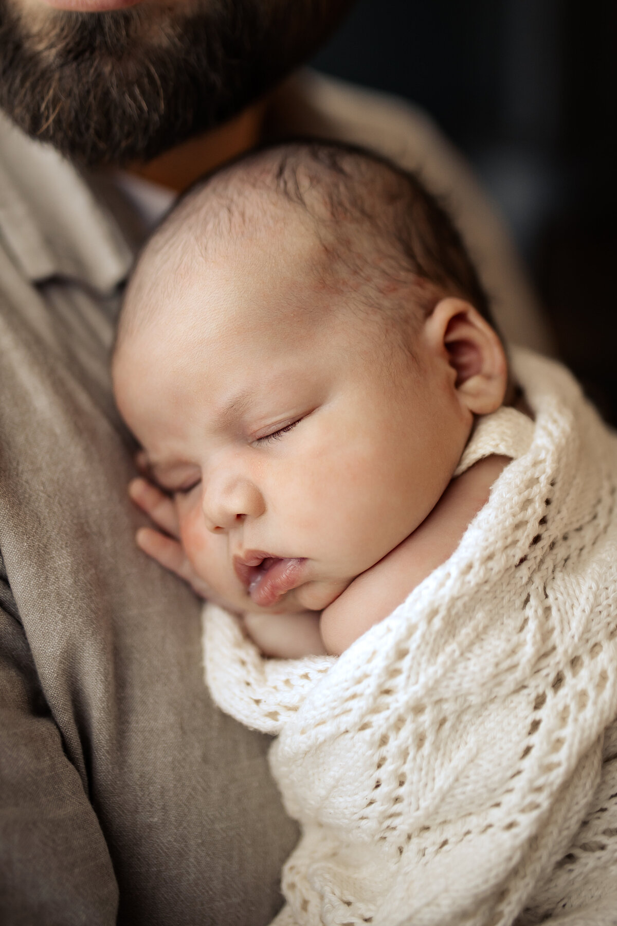 Newborn baby yawning peacefully in a cozy Hawke’s Bay home – heartwarming newborn photography by a local Hawke’s Bay photographer, capturing tender moments in Napier, Hastings, and Havelock North