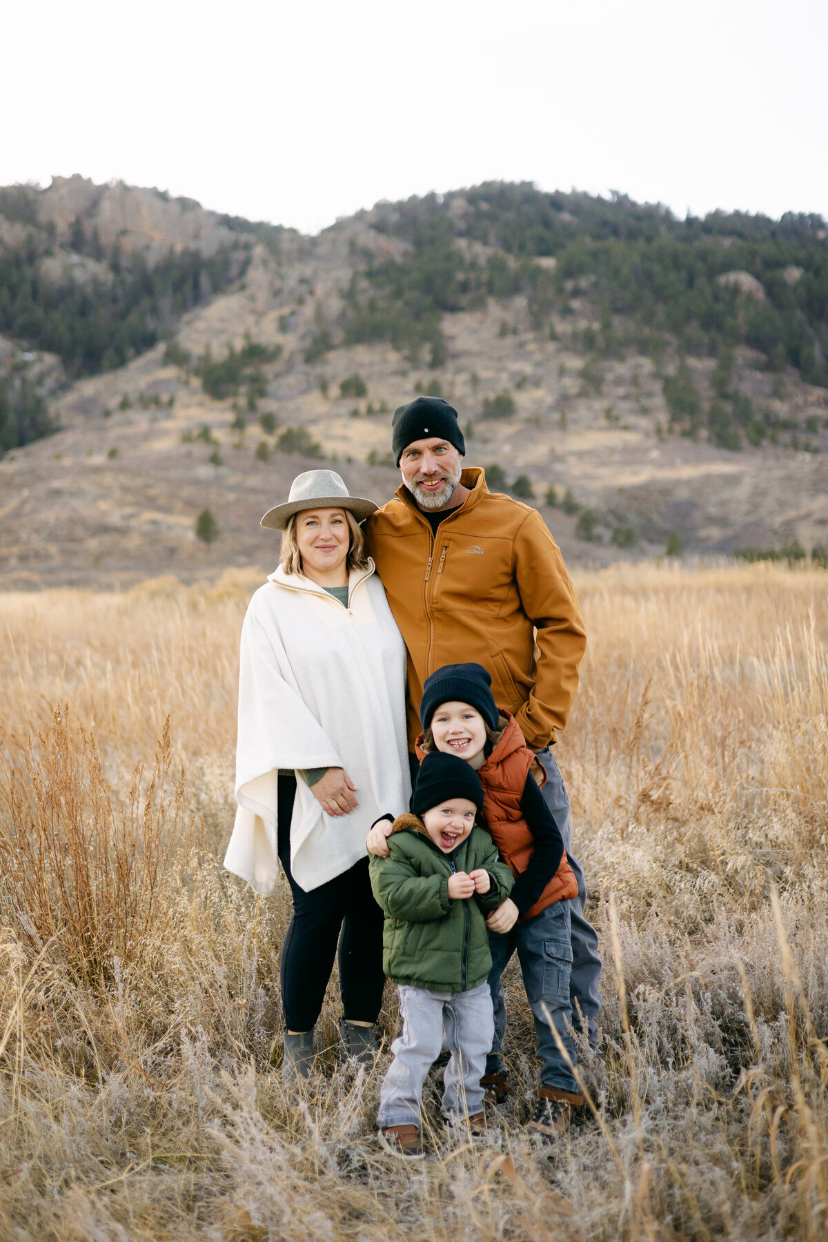 A family poses for a photo in a field of Lory State Park in Fort Collins, Colorado.