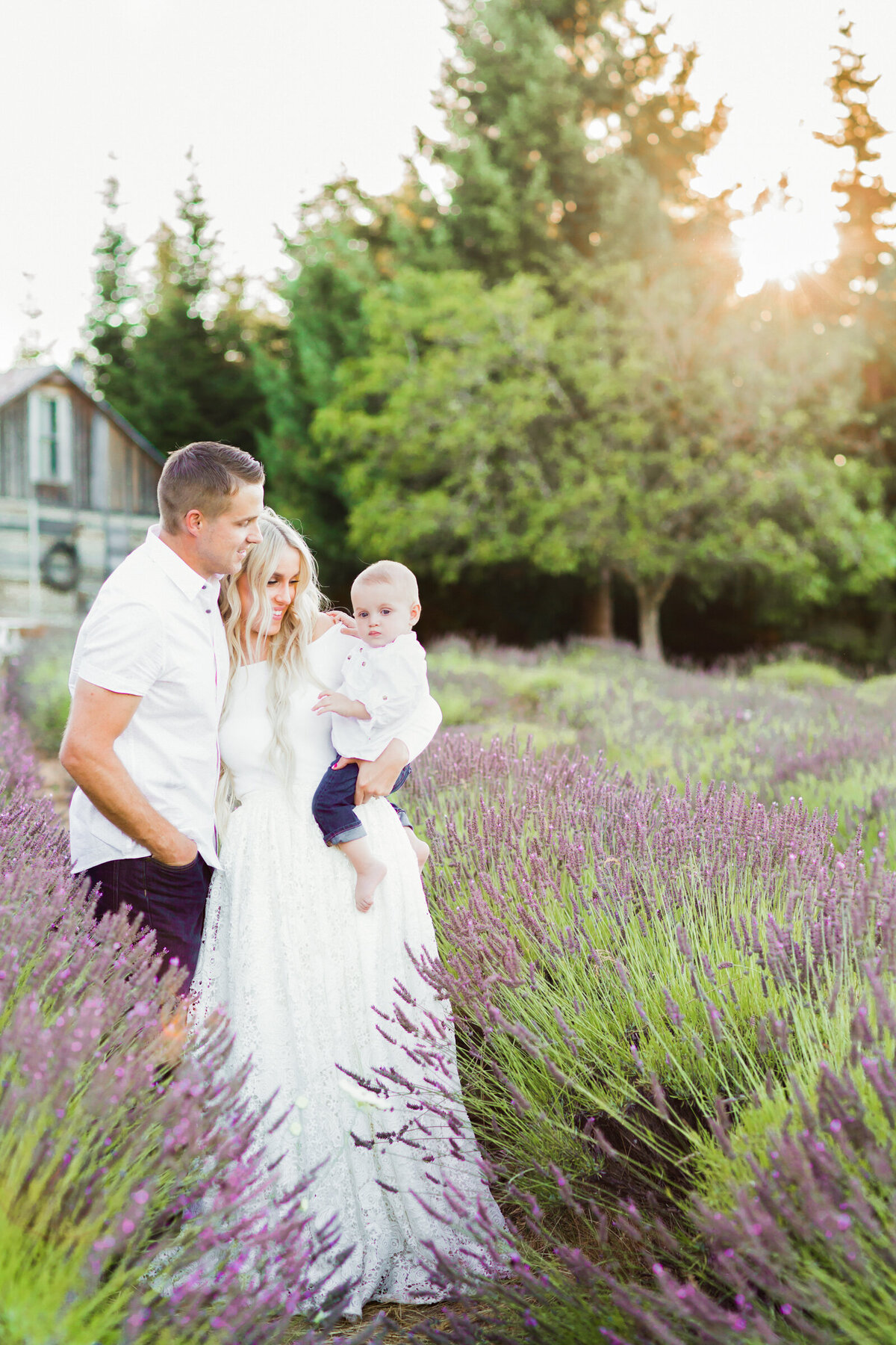 family smiling together in lavender field