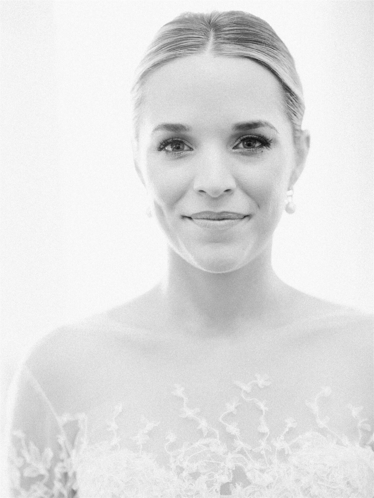 Up close black and white photo of the bride's face. 