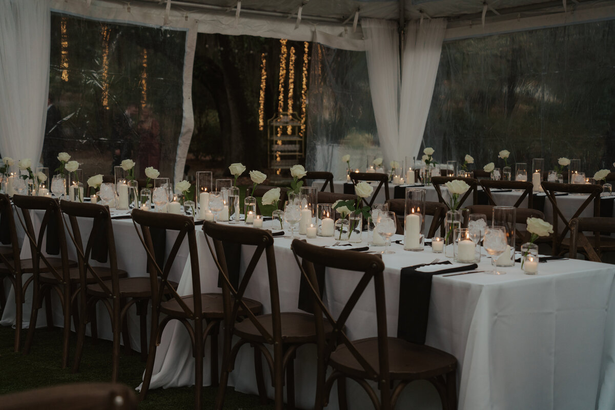 Reception tables under a tent with views of The Admiral’s House in the background