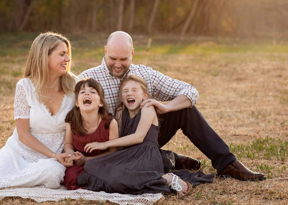 Portrait photographer captures daughters laughing as they are tickled in NJ