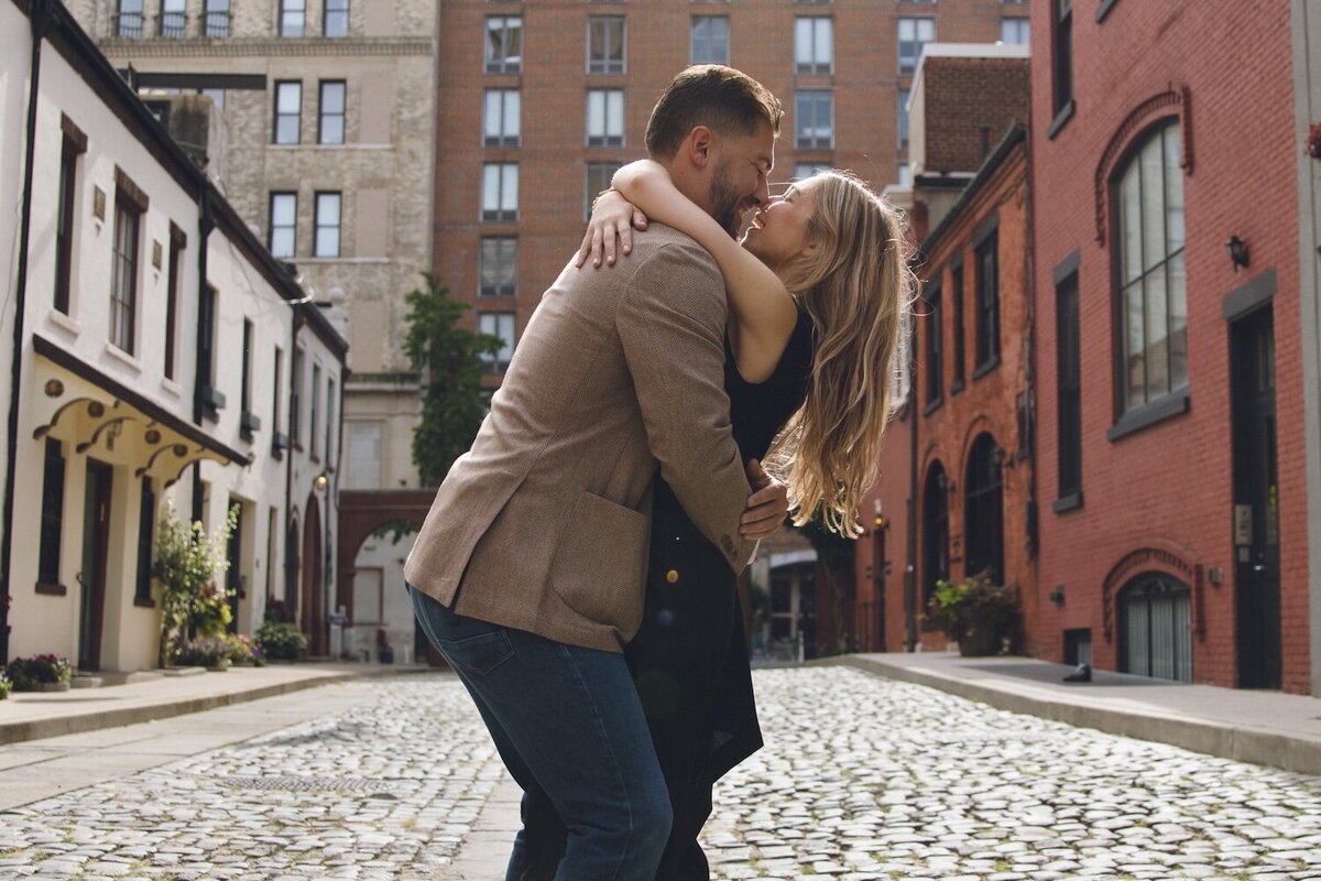 Playful candid moment of the couple laughing during the engagement session.