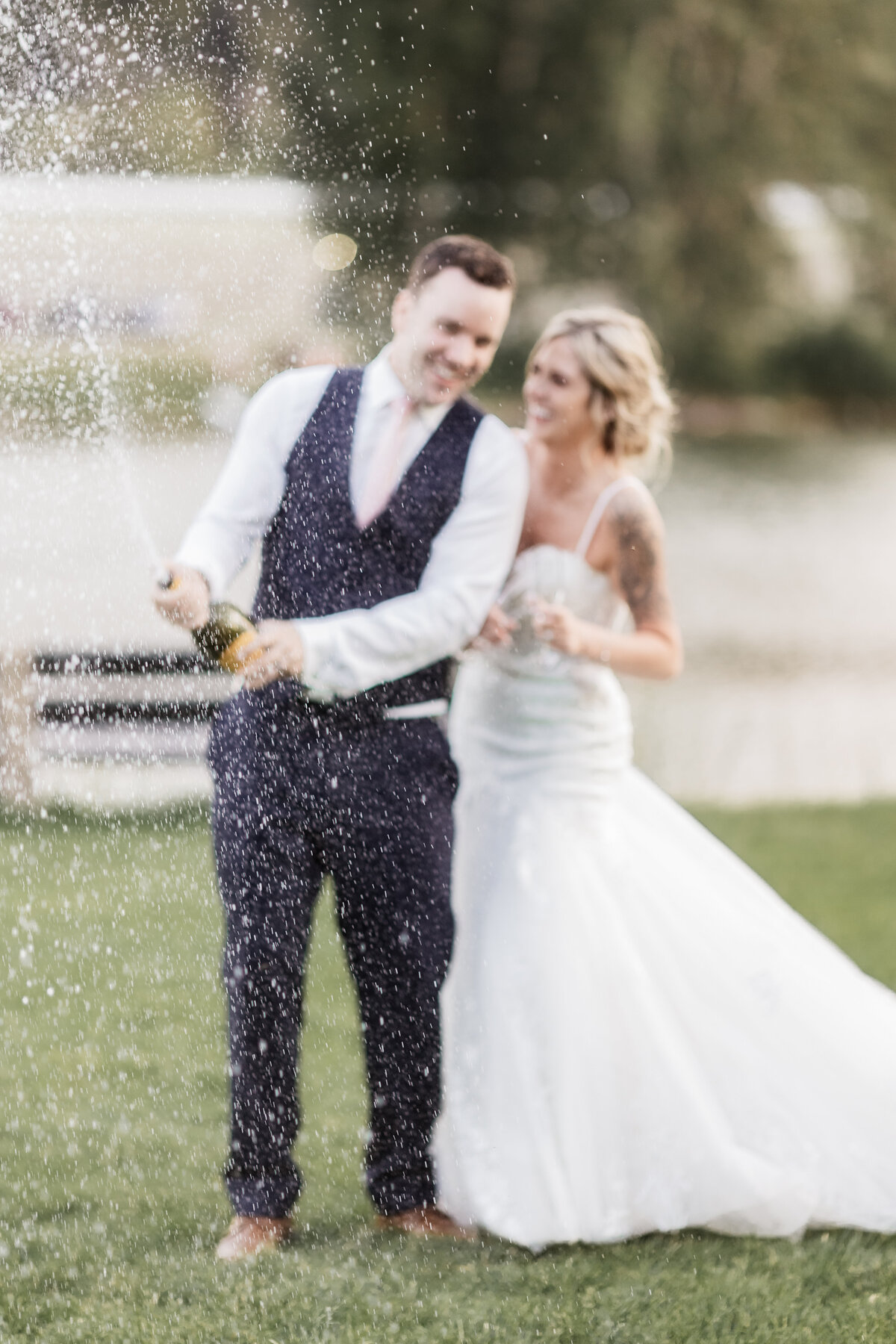 Bride and groom do a champagne pop at Waterfront Park