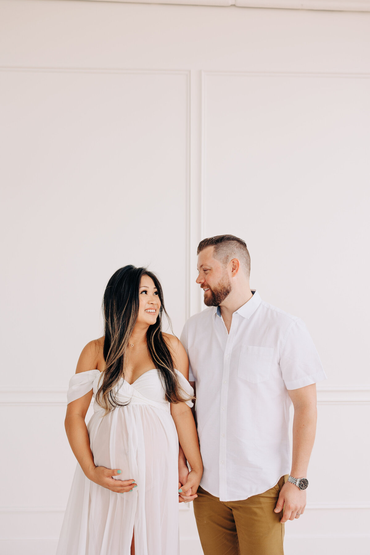 couple looking at each other during a maternity session
