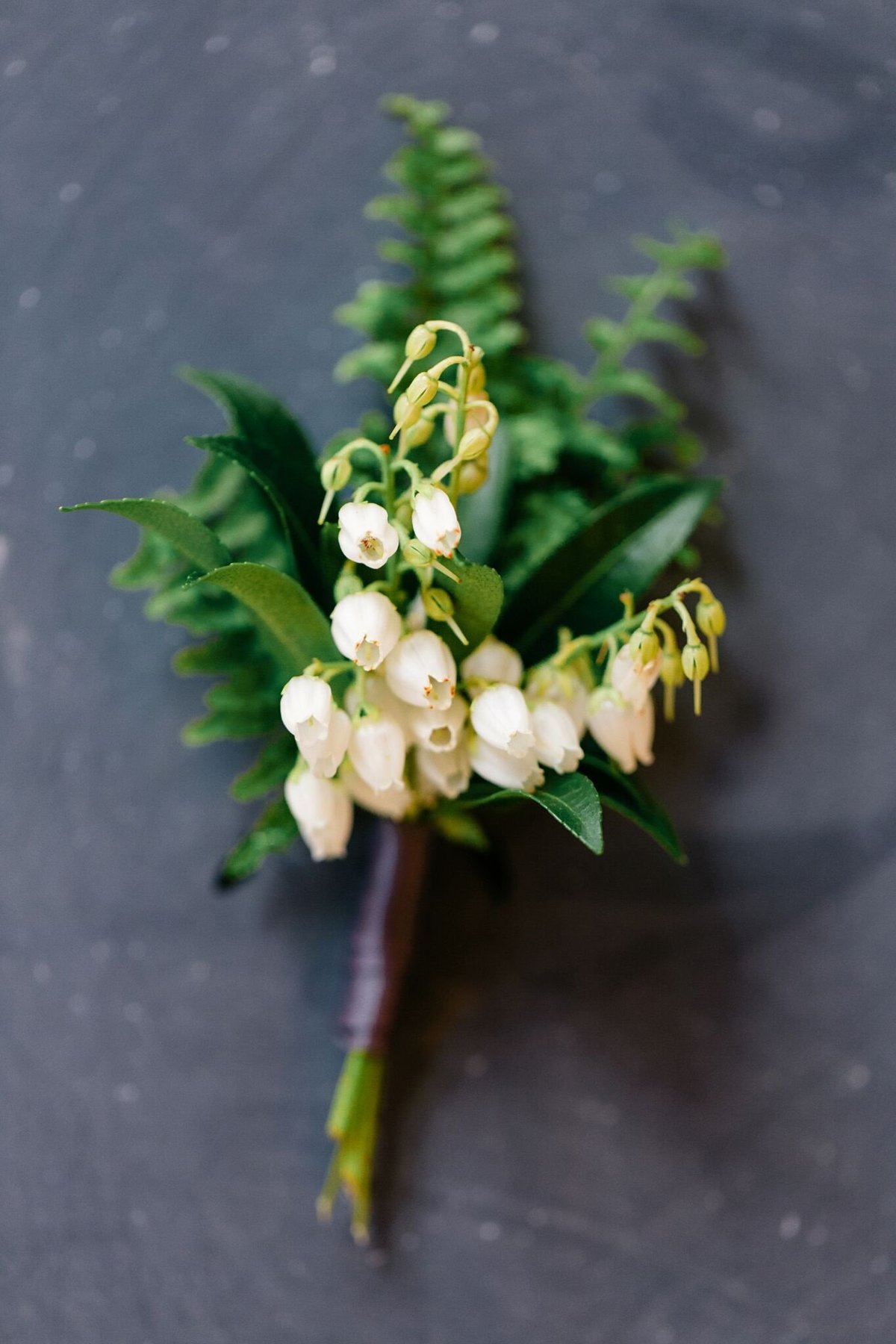 fern and white boutonniere