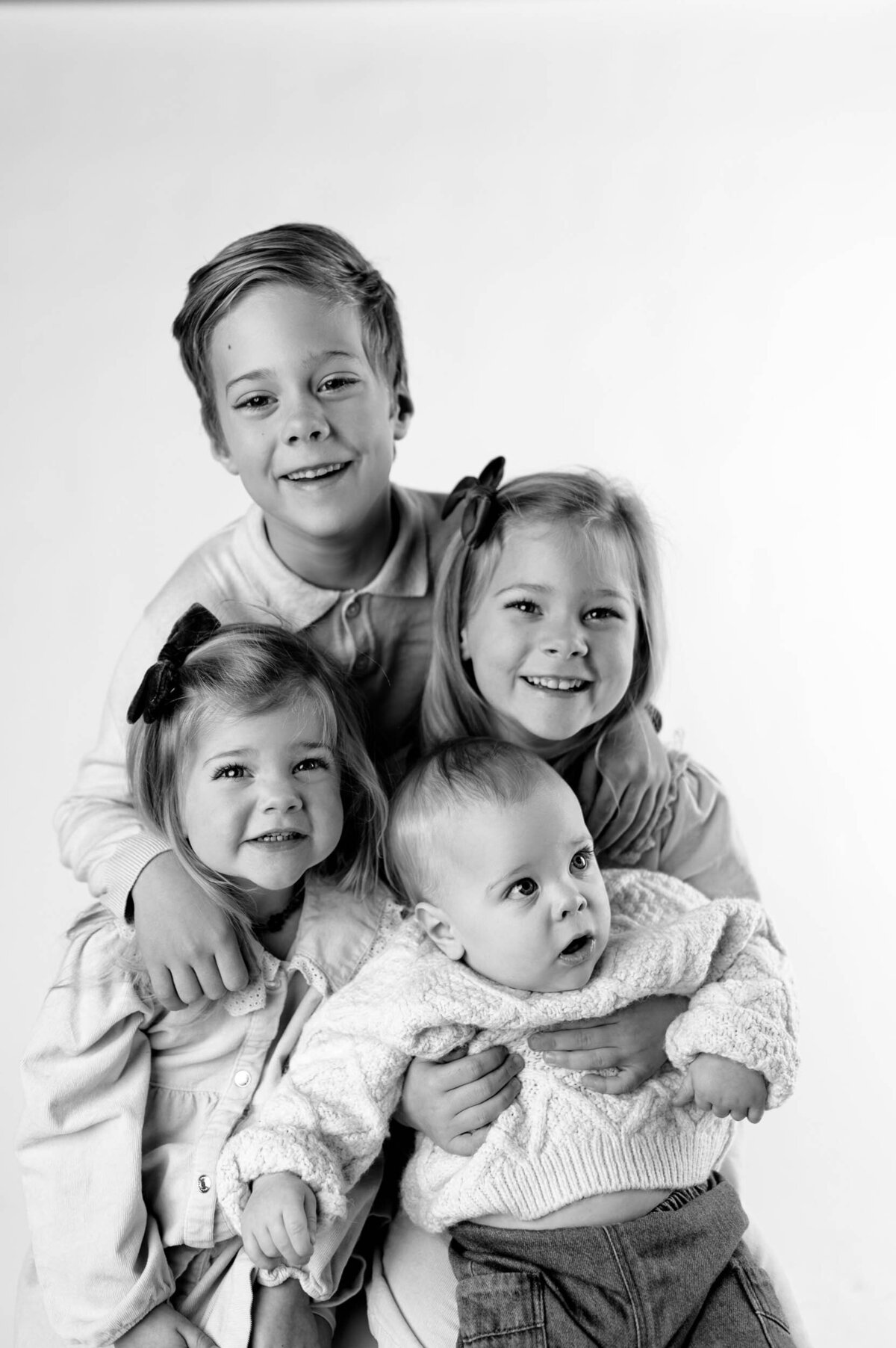 four siblings studio portrait