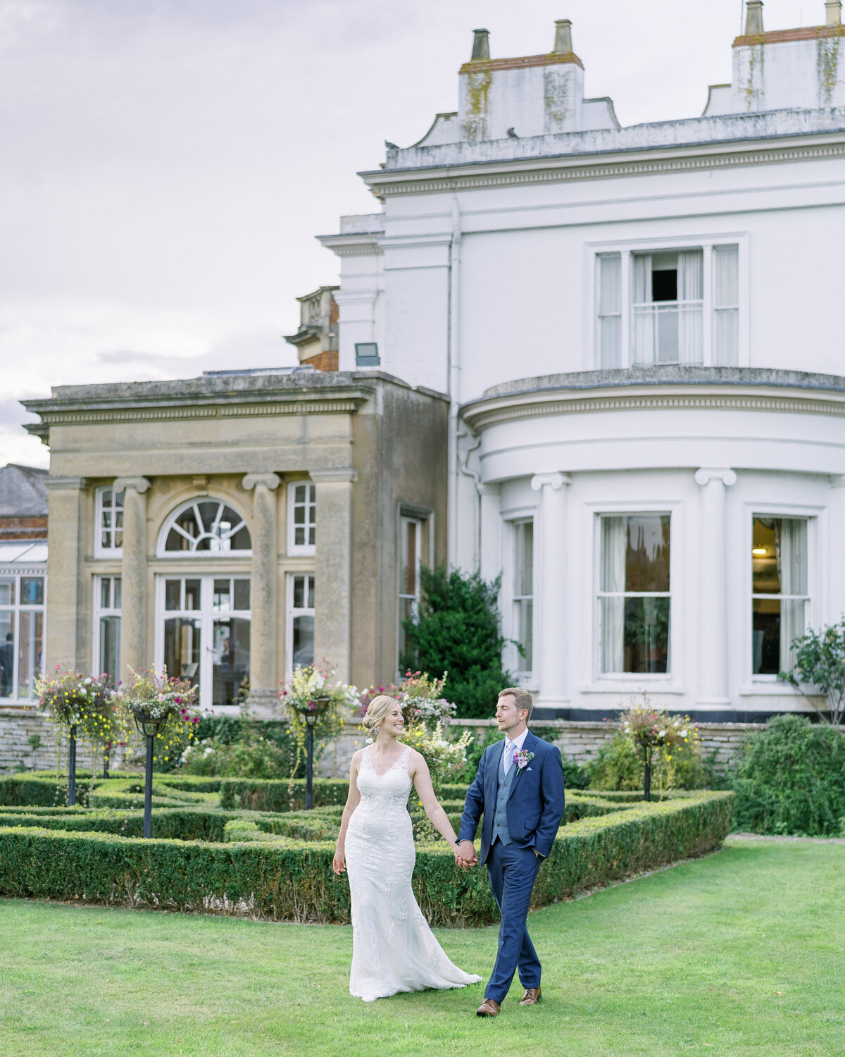 Bride and groom exploring the grounds at Cotswolds Wedding